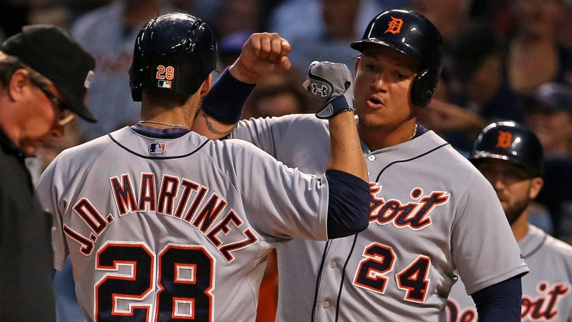 CHICAGO, IL - AUGUST 18: J.D. Martinez #28 of the Detroit Tigers is greeted by Miguel Cabrera #24 after he hit a two-run home run in the 1st inning against the Chicago Cubs at Wrigley Field on August 18, 2015 in Chicago, Illinois. (Photo by Jonathan Daniel/Getty Images)
