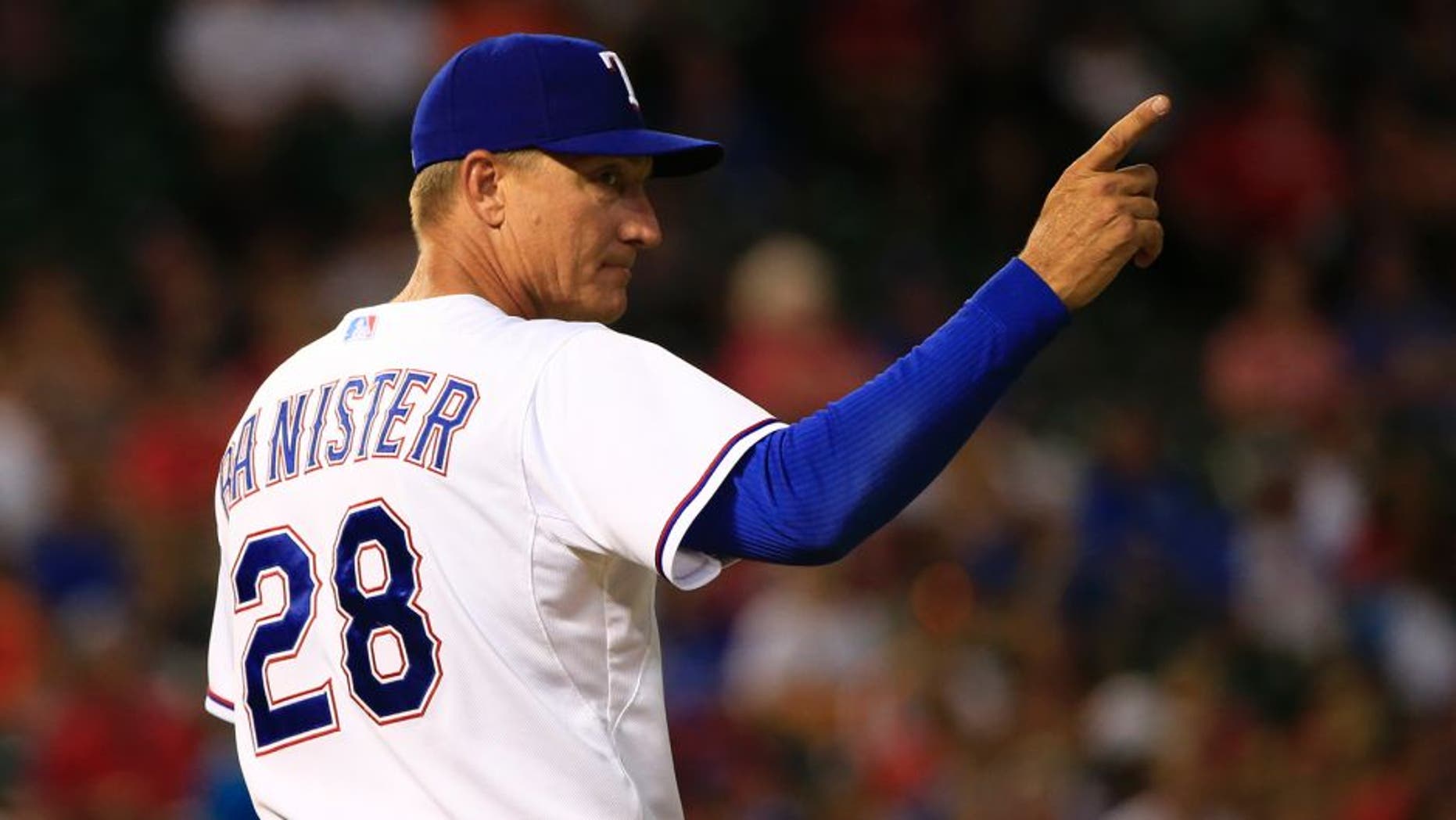 Aug 3, 2015; Arlington, TX, USA; Texas Rangers manager Jeff Banister (28) makes a pitching change during the game against the Houston Astros at Globe Life Park in Arlington. Mandatory Credit: Kevin Jairaj-USA TODAY Sports
