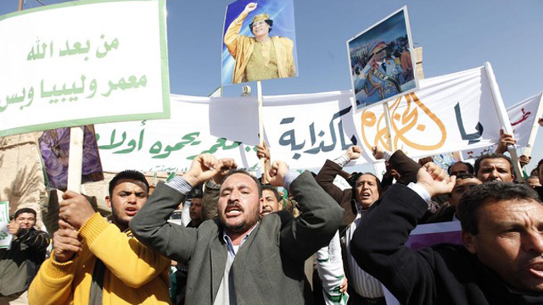 Feb. 17: Pro-government supporters chant slogans during a demonstration in Tripoli.