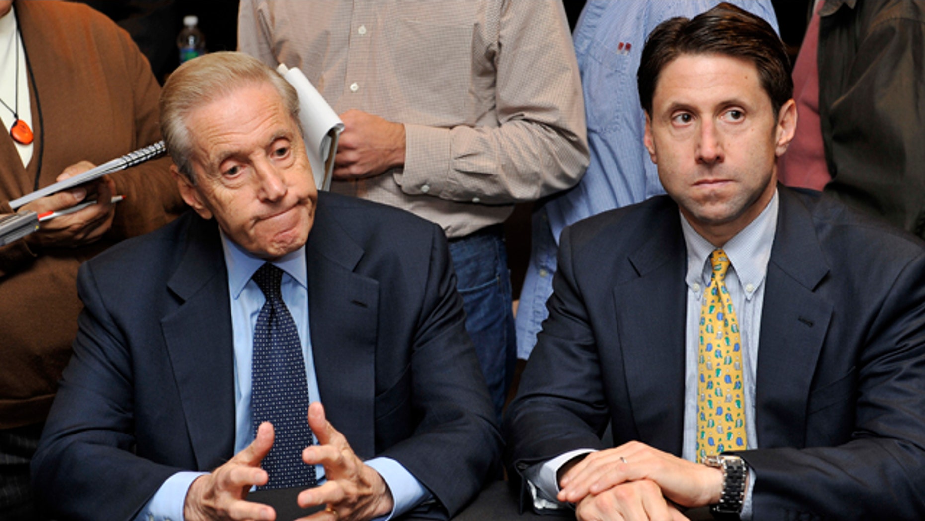 Oct. 29, 2010: New York Mets owner Fred Wilpon, left, and COO Jeff Wilpon, listen to a question from the media during a baseball news conference in New York.