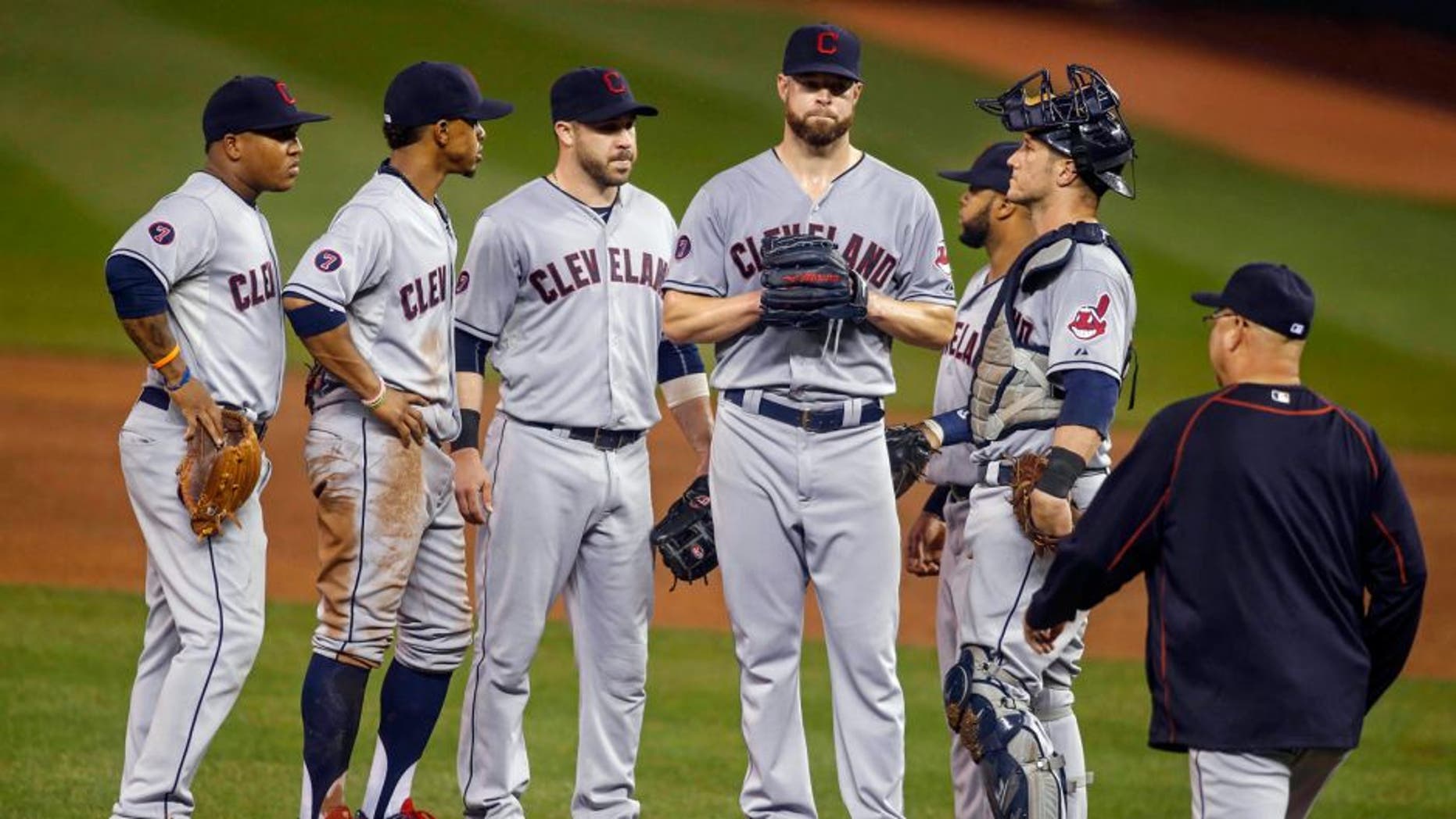 Sep 23, 2015; Minneapolis, MN, USA; Cleveland Indians shortstop Jose Ramirez (11) and shortstop Francisco Lindor (12) and second baseman Jason Kipnis (22) and first baseman Carlos Santana (41) and catcher Yan Gomes (10) wait with starting pitcher Corey Kluber (28) as manager Terry Francona comes to remove him from the game with the Minnesota Twins in the fourth inning at Target Field. Mandatory Credit: Bruce Kluckhohn-USA TODAY Sports