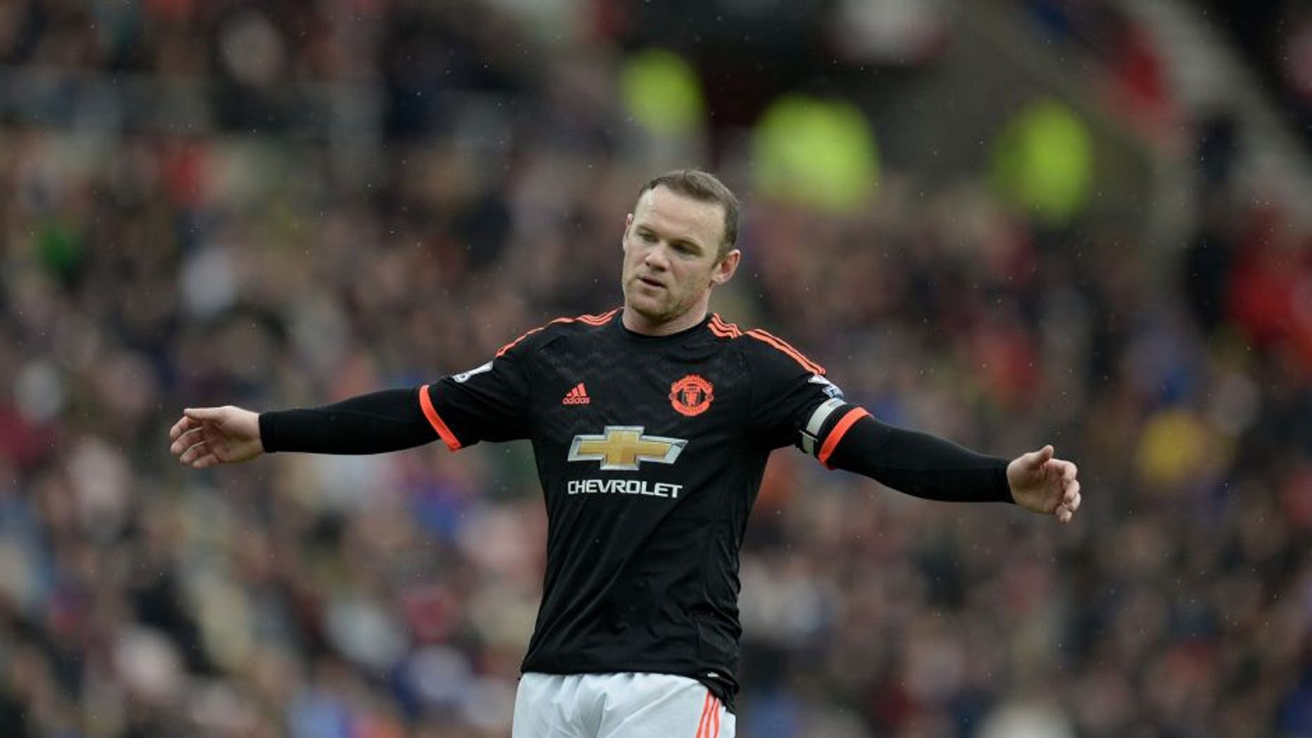 Manchester United's English striker Wayne Rooney reacts during the English Premier League football match between Sunderland and Manchester United at the Stadium of Light in Sunderland, northeast England on February 13, 2016. / AFP / OLI SCARFF / RESTRICTED TO EDITORIAL USE. No use with unauthorized audio, video, data, fixture lists, club/league logos or 'live' services. Online in-match use limited to 75 images, no video emulation. No use in betting, games or single club/league/player publications. / (Photo credit should read OLI SCARFF/AFP/Getty Images)