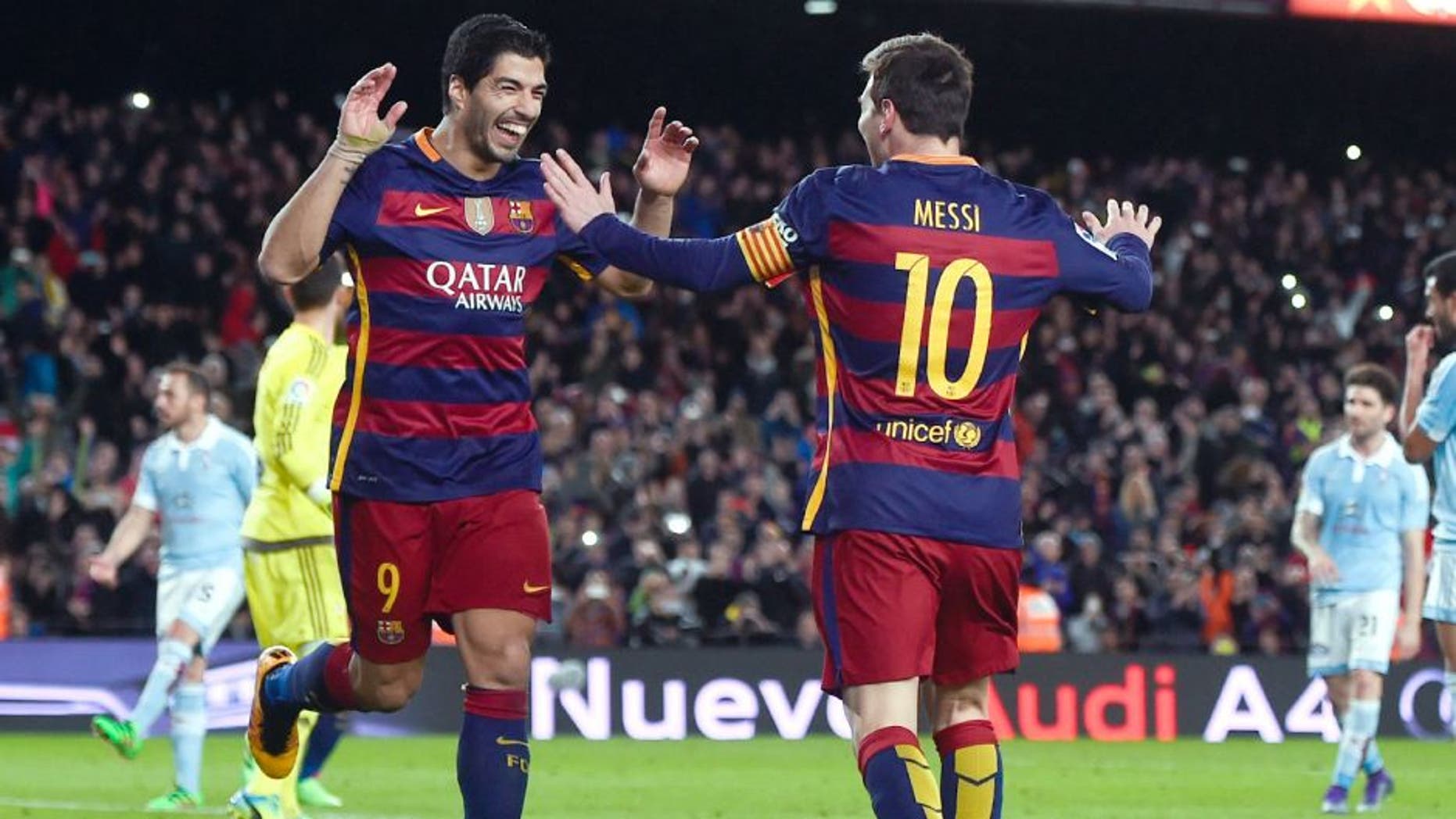 BARCELONA, SPAIN - FEBRUARY 14: (L-R) Luis Suarez of FC Barcelona celebrates with his team mate Lionel Messi of FC Barcelona after scoring his team's fourth goal from the penalty spot during the La Liga match between FC Barcelona and Celta Vigo at Camp Nou on February 14, 2016 in Barcelona, Spain. (Photo by David Ramos/Getty Images)