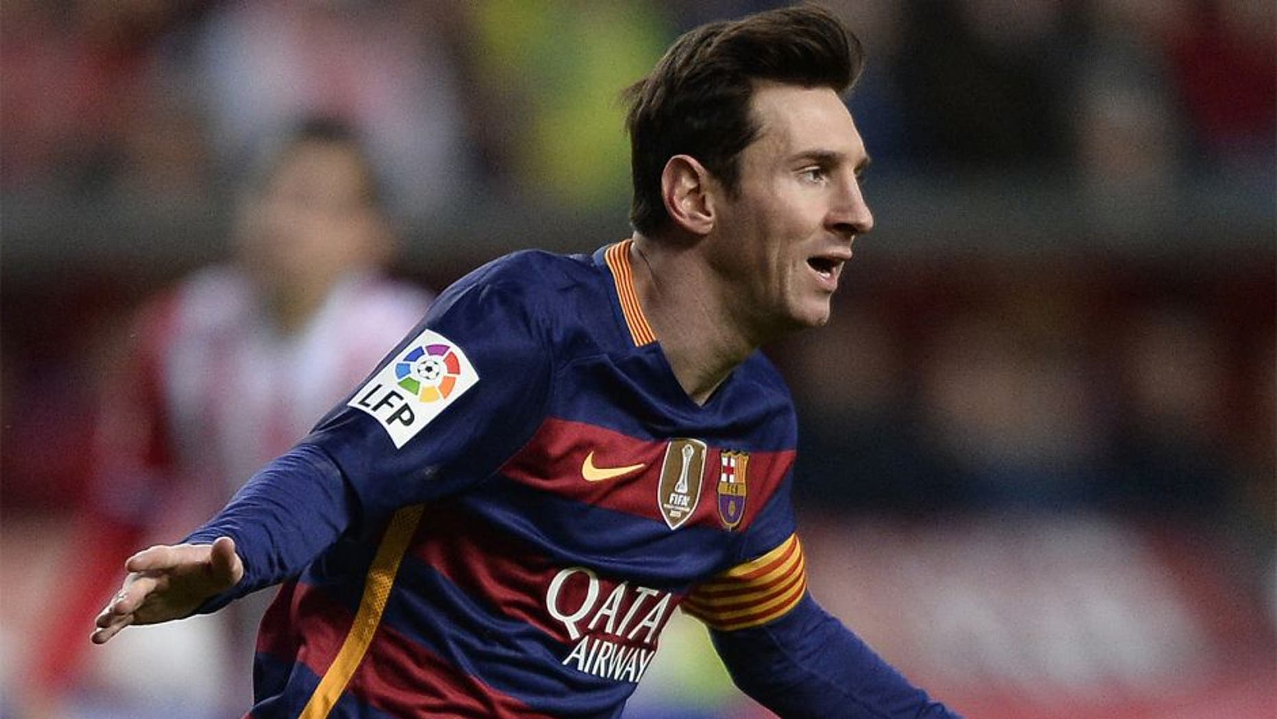 Barcelona's Argentinian forward Lionel Messi celebrates after scoring a goal during the Spanish league football match Real Sporting de Gijon vs FC Barcelona at El Molinon stadium in Gijonon 2016. AFP PHOTO / MIGUEL RIOPA / AFP / MIGUEL RIOPA (Photo credit should read MIGUEL RIOPA/AFP/Getty Images)