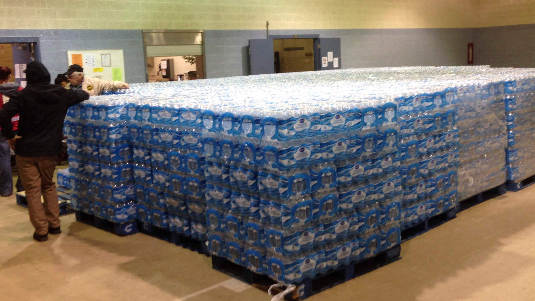 Pallets of water, ready for distribution in the community, sit at the Sebring Community Center, Tuesday, Jan. 26, 2016 in Sebring, Ohio.