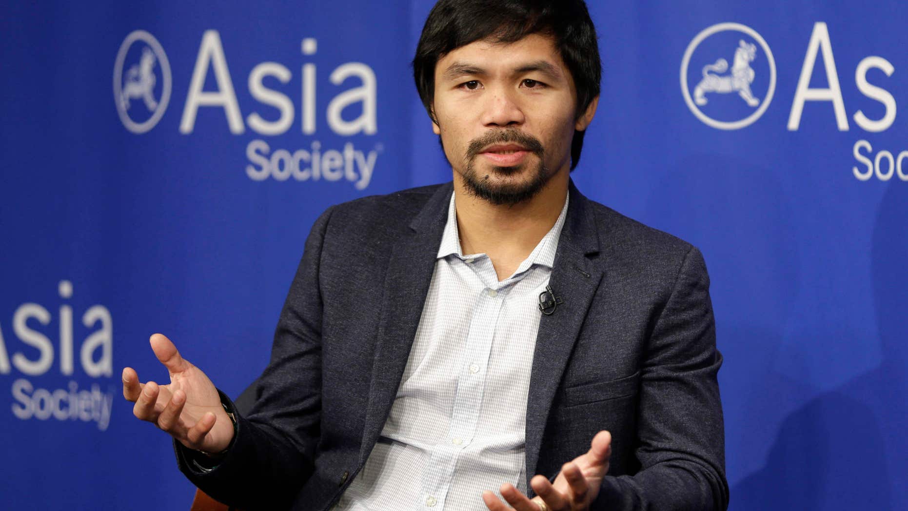 FILE - In this Oct. 12, 2015, file photo, Manny Pacquiao takes questions at the Asia Society in New York.
