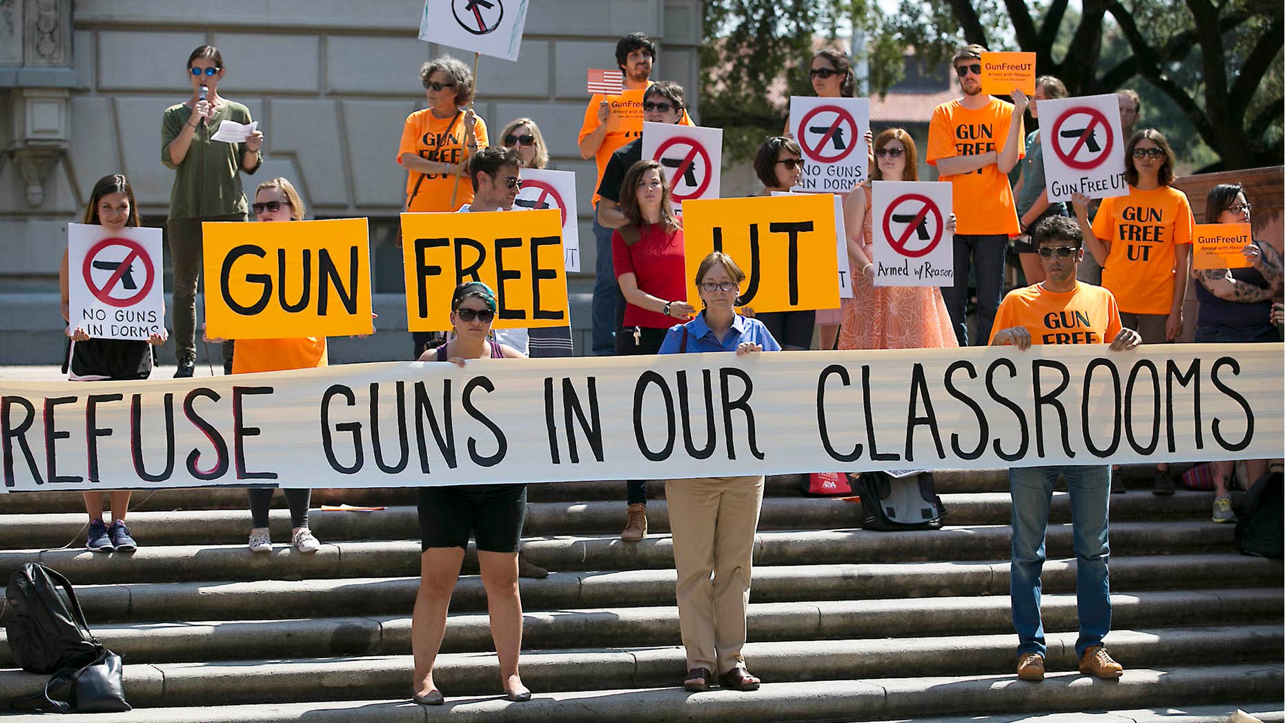 FILE - In this Oct. 1, 2015, file photo, protesters gather on the West Mall of the University of Texas campus to oppose a new state law that expands the rights of concealed handgun license holders to carry their weapons on public college campuses.