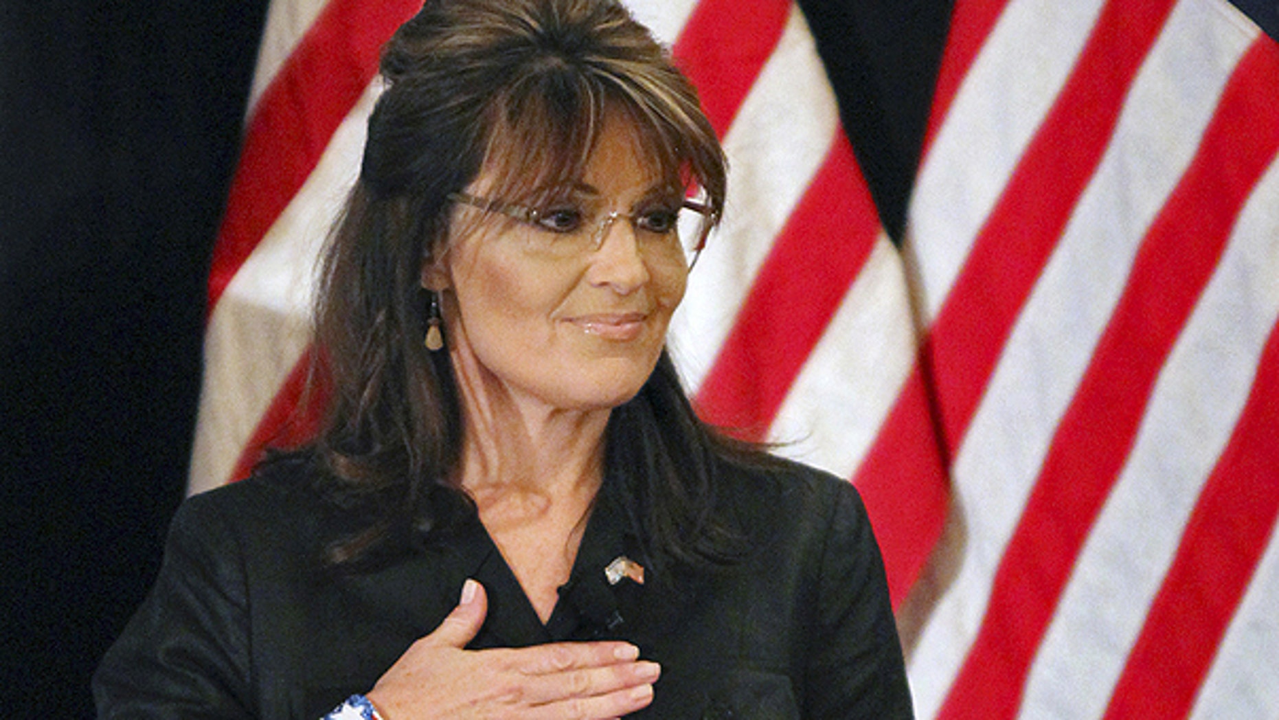 Feb. 17: Former Alaska Gov. Sarah Palin covers her heart during the national anthem as she attends a public appearance at a Long Island Association (LIA) meeting and luncheon in Woodbury, N.Y.