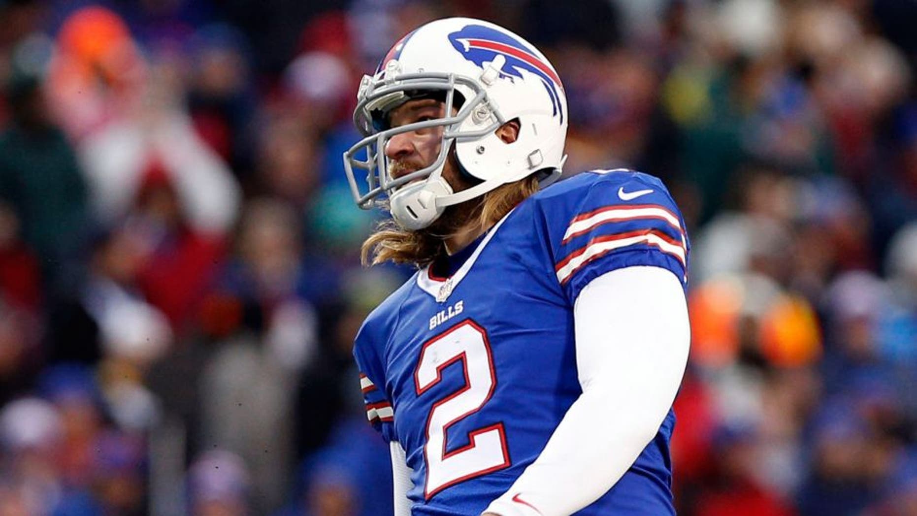 Dec 22, 2013; Orchard Park, NY, USA; Buffalo Bills kicker Dan Carpenter (2) kicks a field goal as punter Brian Moorman (8) holds during the second half against the Miami Dolphins at Ralph Wilson Stadium. Bills beat the Dolphins 19-0. Mandatory Credit: Kevin Hoffman-USA TODAY Sports