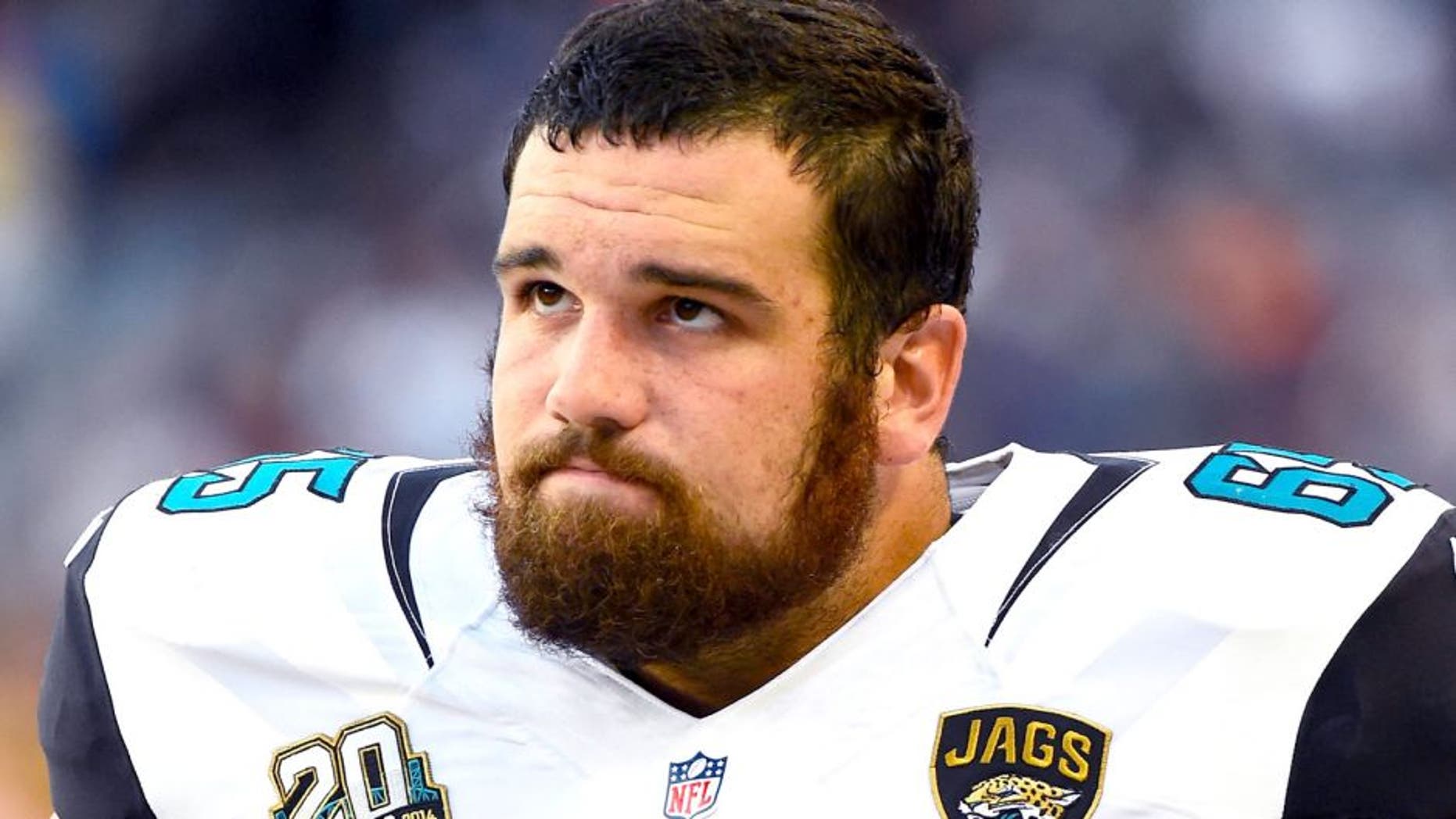 Aug 14, 2014; Chicago, IL, USA; Jacksonville Jaguars offensive guard Brandon Linder (65) during the first quarter of the preseason game at Soldier Field. Mandatory Credit: Mike DiNovo-USA TODAY Sports