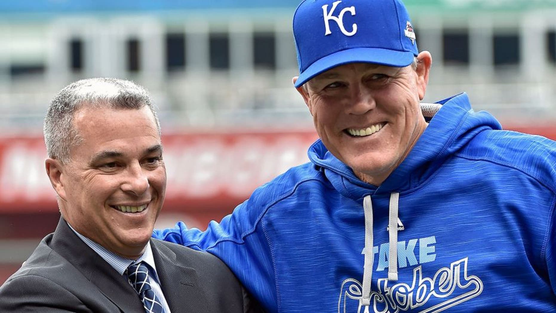 Kansas City Royals general manager Dayton Moore and manager Ned Yost are introduced during Tuesday's Kansas City Royals rally and public workout on October 6, 2015 at Kauffman Stadium in Kansas City, Mo. (John Sleezer/Kansas City Star/TNS via Getty Images)