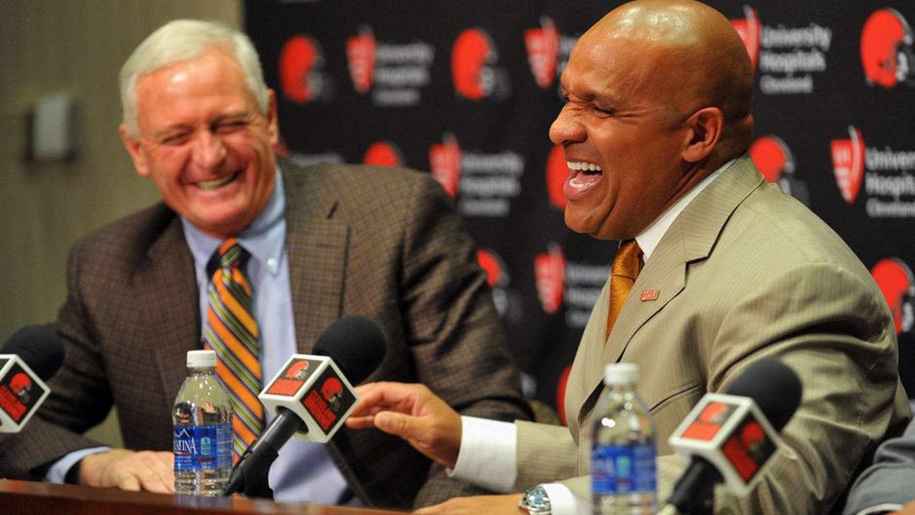 Jan 13, 2016; Berea, OH, USA; Cleveland Browns owner Jimmy Haslam (left) and new head coach Hue Jackson talk during a press conference at the Cleveland Browns training facility. Mandatory Credit: Ken Blaze-USA TODAY Sports