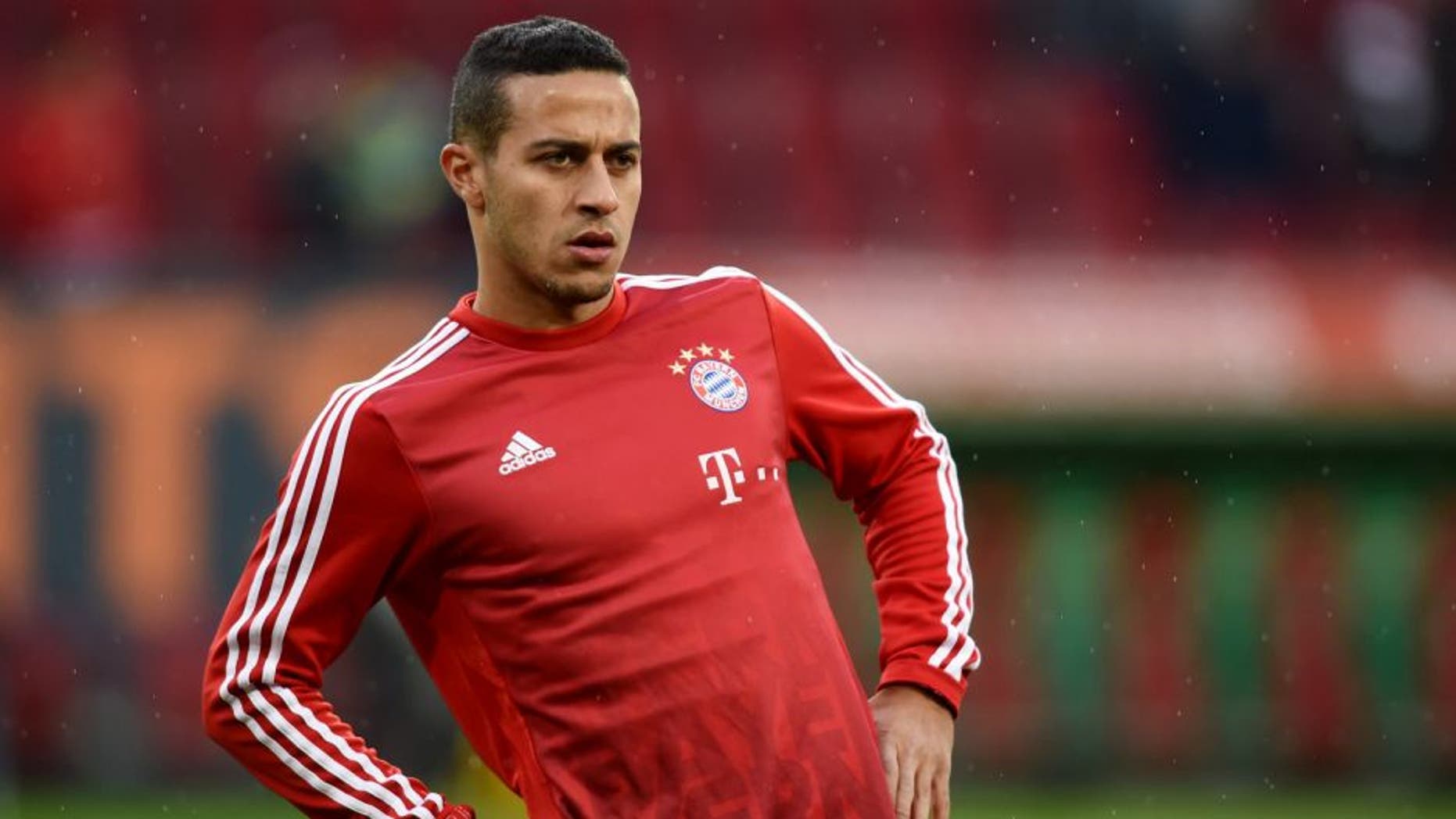 Bayern Munich's Spanish midfielder Thiago Alcantara warms up prior the German first division Bundesliga football match FC Augsburg 1907 and FC Bayern Munich in the stadium in Augsburg, on February 14, 2016. / AFP / CHRISTOF STACHE (Photo credit should read CHRISTOF STACHE/AFP/Getty Images)