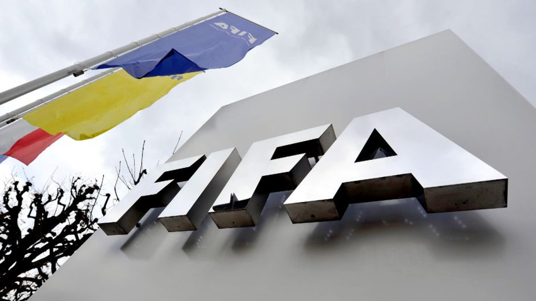 ZURICH, SWITZERLAND - OCTOBER 09: A FIFA logo next to the entrance at the FIFA headquarters on October 9, 2015 in Zurich, Switzerland. On Thursday, FIFA's Ethics Committee provisionally banned FIFA President Joseph S. Blatter from all football activities for the duration of 90 days. (Photo by Harold Cunningham/Getty Images)