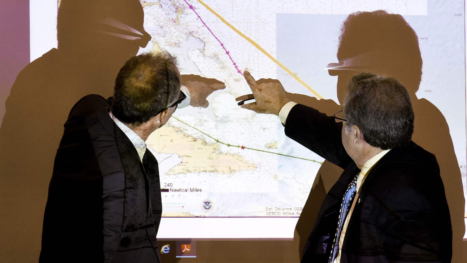 Baird, former second mate of the El Faro, left, and Mike Kucharski with the National Transportation Safety Board discuss route options available to the El Faro when dealing with the approaching hurricane during a hearing investigating the ship’s sinking last October, Thursday, Feb. 18, 2016, in Jacksonville, Fla.
