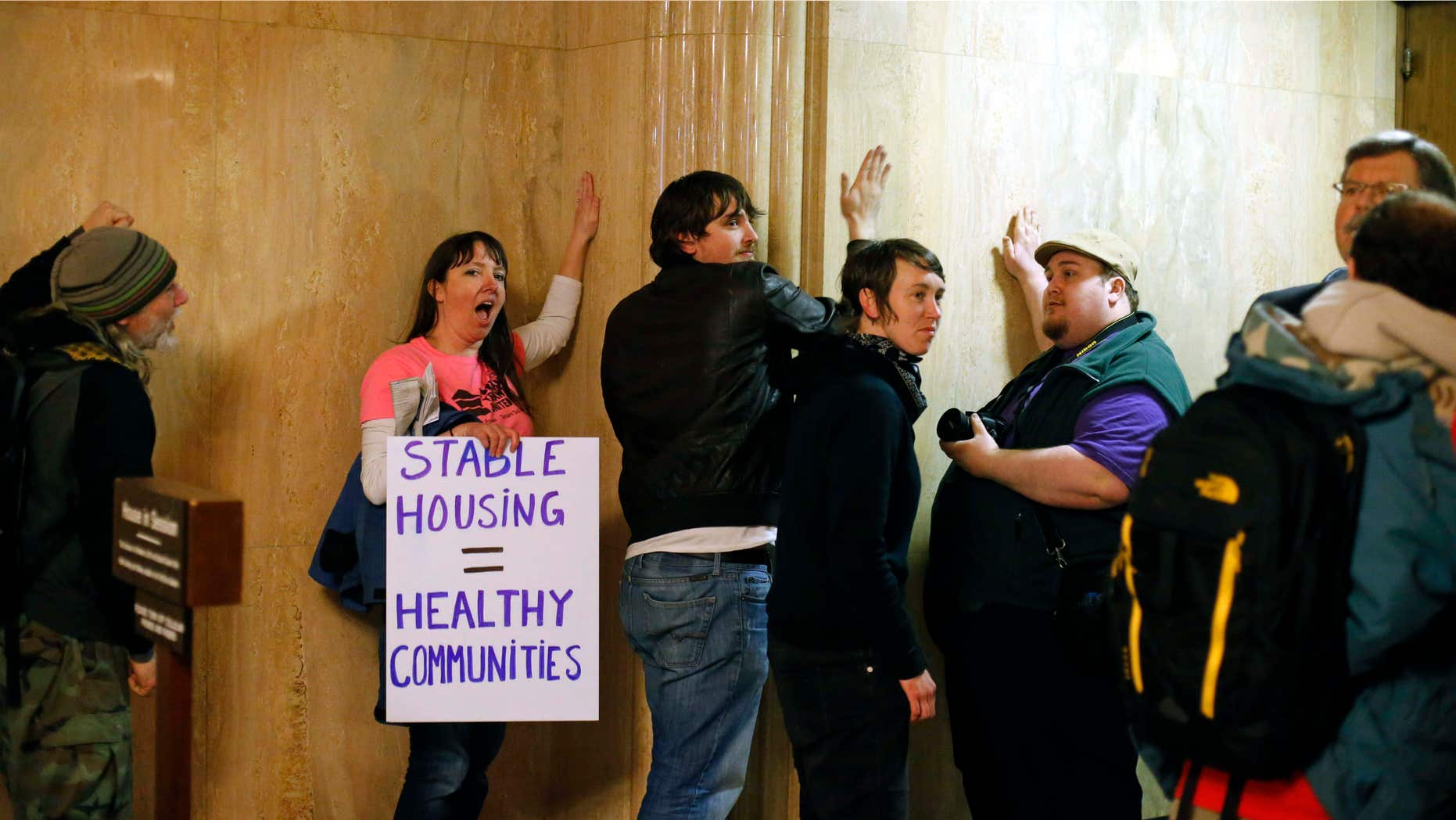 Feb. 18, 2016: Protesters pound on the walls outside of the House Chamber in the Capitol Building, in Salem , Ore.