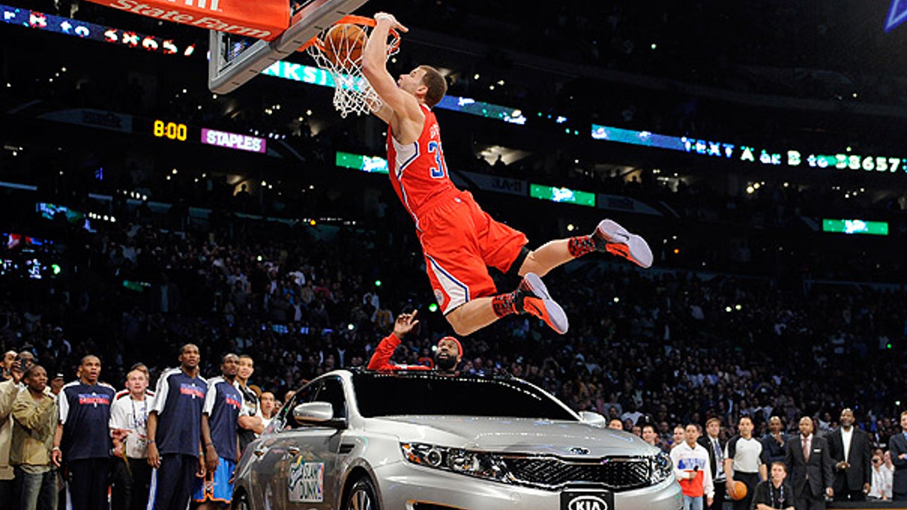 Feb. 19: Los Angeles Clippers' Blake Griffin dunks over a car as teammate Baron Davis looks on from inside the car during the Slam Dunk Contest in Los Angeles.