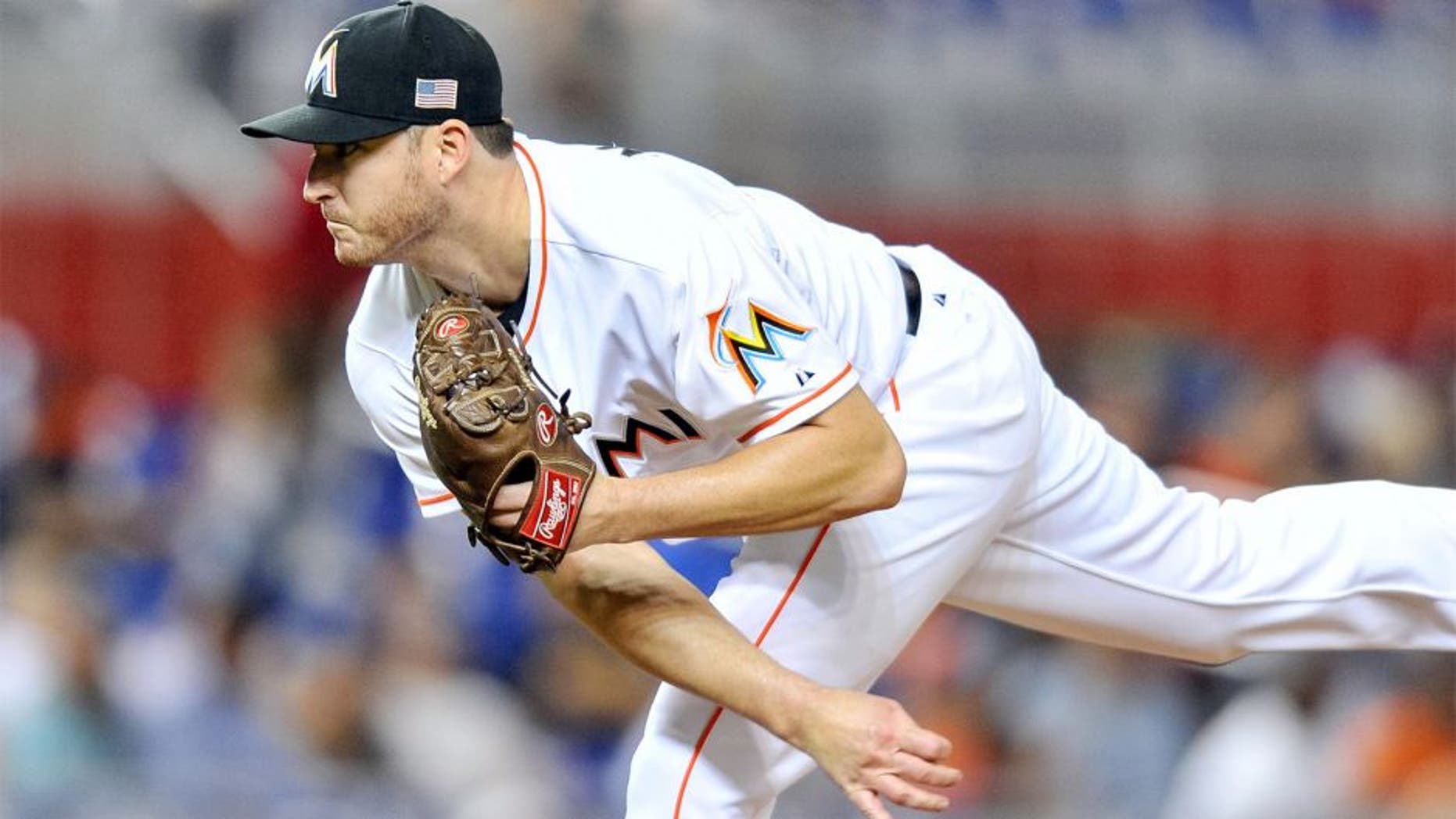 Sep 11, 2015; Miami, FL, USA; Miami Marlins relief pitcher Bryan Morris (57) delivers a pitch during the seventh inning against the Washington Nationals at Marlins Park. The Marlins won 2-1. Mandatory Credit: Steve Mitchell-USA TODAY Sports