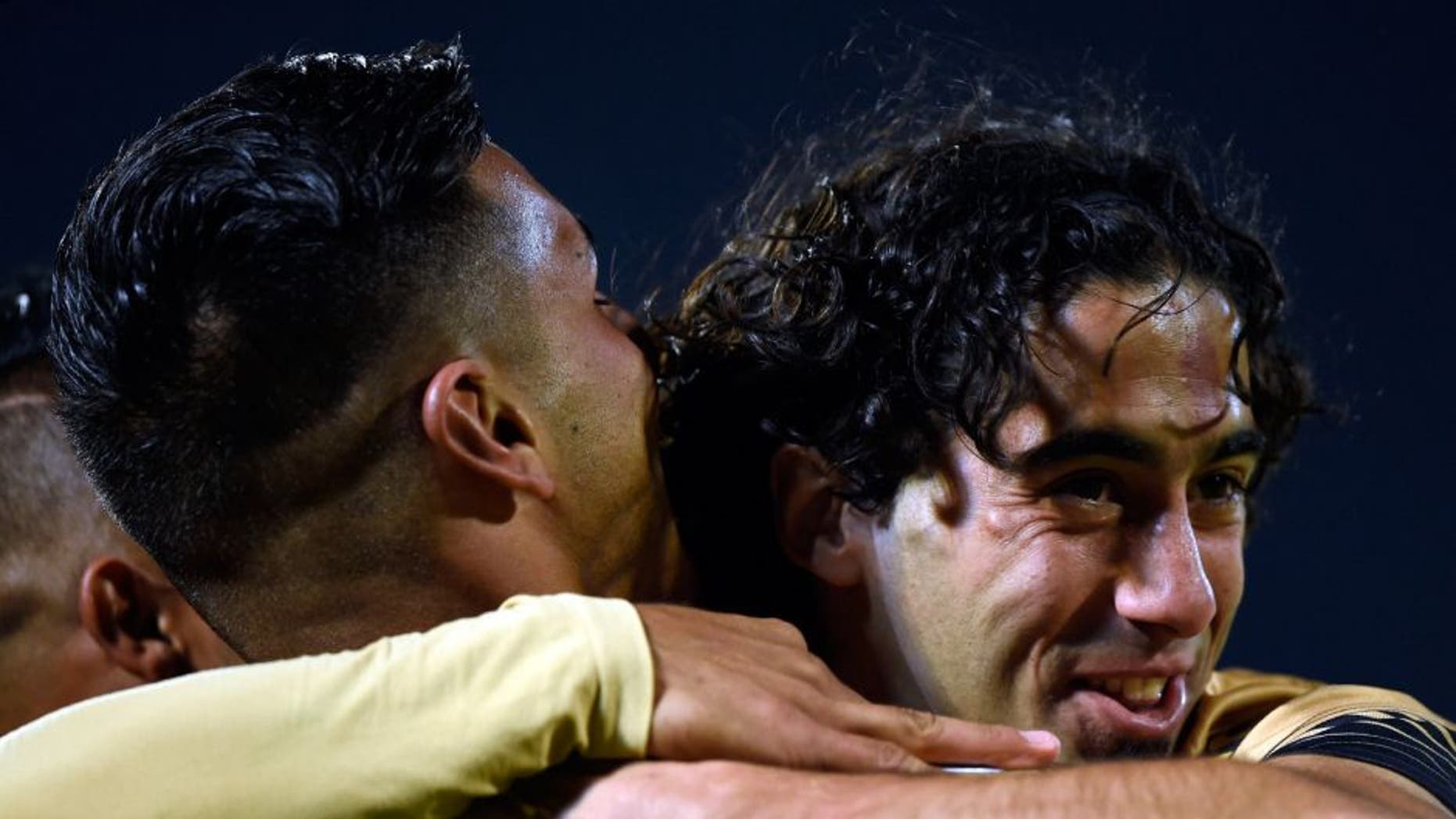 Ismael Sosa (L) of Pumas from Mexico celebrates his goal against Emele from Ecuador with his teammate Matias Britos during their Copa Libertadores 2016 tournament football match at the Olimpico Universitario stadium on February 18, 2016, in Mexico City. / AFP / ALFREDO ESTRELLA (Photo credit should read ALFREDO ESTRELLA/AFP/Getty Images)