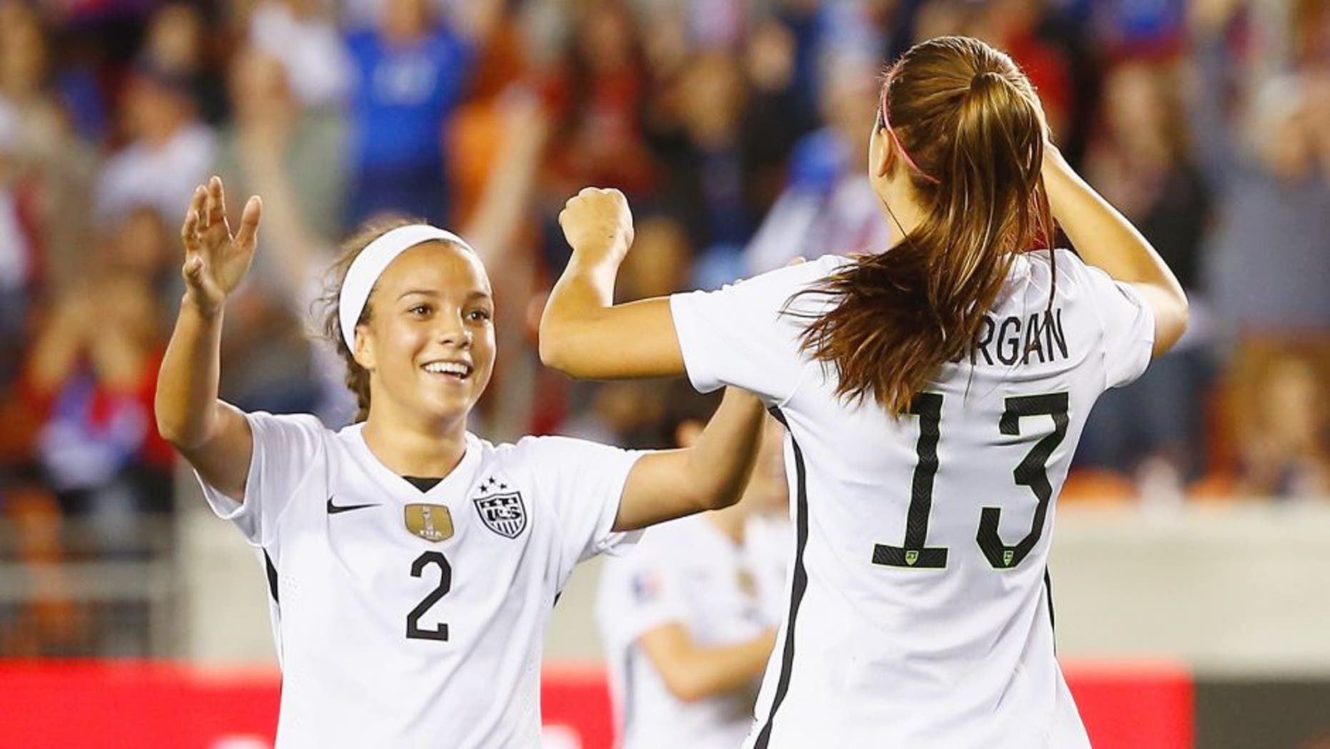 HOUSTON, TX - FEBRUARY 19: Mallory Pugh #2 and Alex Morgan #13 of the United States celebrate after Morgan scored a goal in the first half of their game against Trinidad and Tobago during their Semifinal of the 2016 CONCACAF Women's Olympic Qualifying at BBVA Compass Stadium on February 19, 2016 in Houston, Texas. (Photo by Scott Halleran/Getty Images)