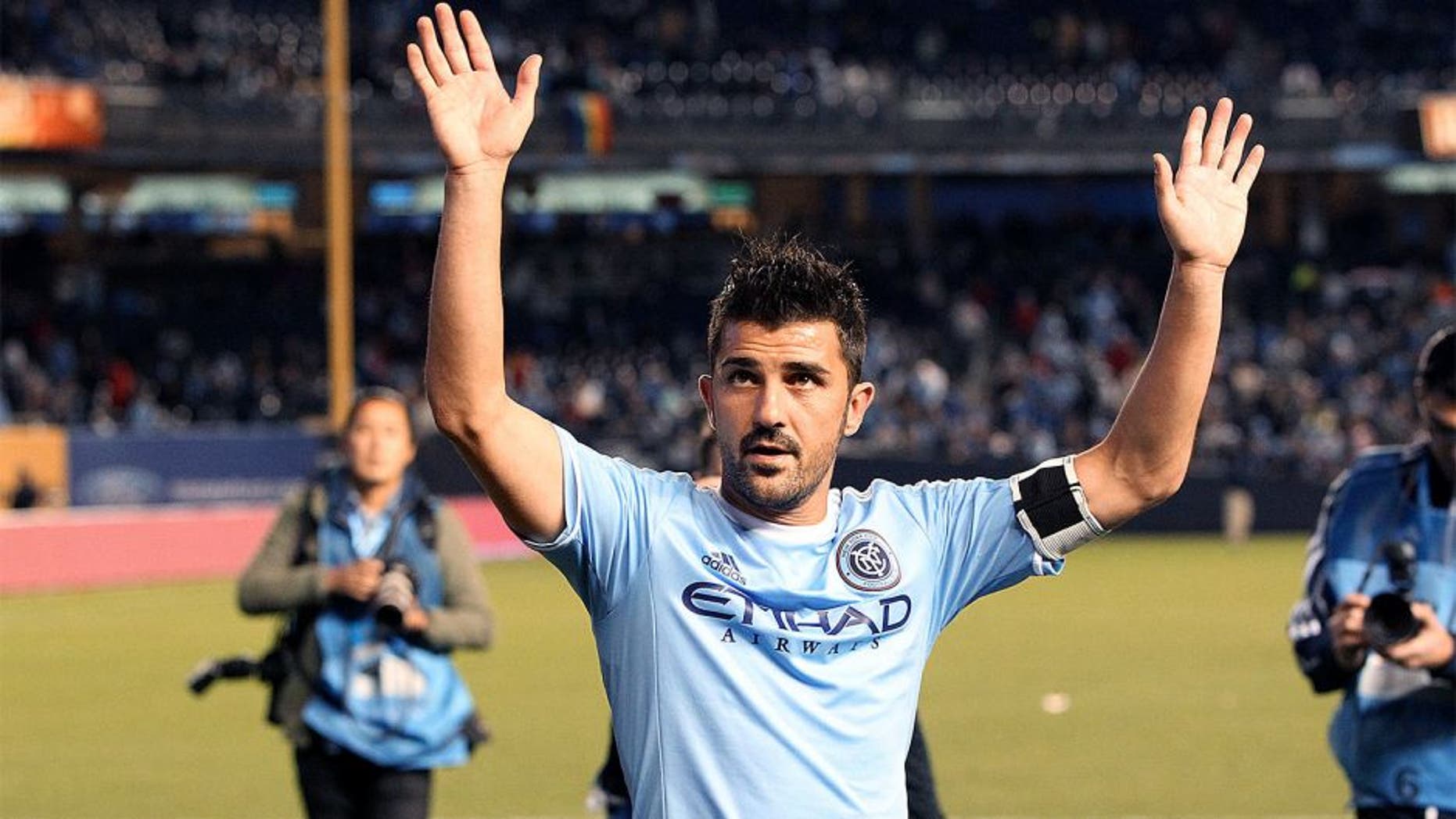 Oct 25, 2015; New York, NY, USA; New York City FC forward David Villa (7) waves after the MLS game against the New England Revolution at Yankee Stadium. The Revolution won, 3-1. Mandatory Credit: Vincent Carchietta-USA TODAY Sports