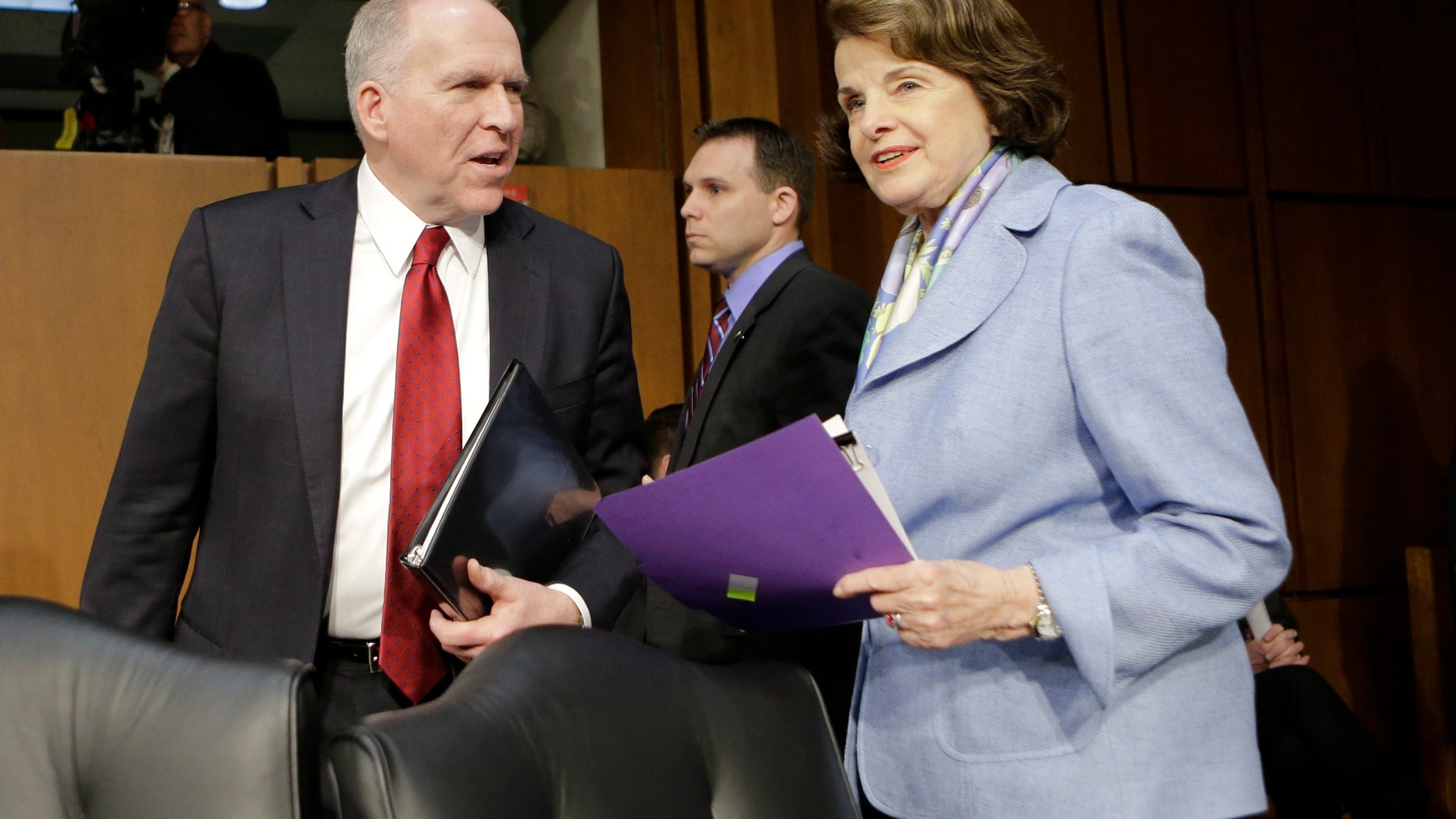 FILE - In this Feb. 7, 2013 file photo, Senate Intelligence Committee Chair Sen. Dianne Feinstein, D-Calif., right, welcomes CIA Director nominee John Brennan on Capitol Hill in Washington, prior to the start of Brennan's confirmation hearing before the committee. Lawmakers are considering whether Congress can set up a court to decide when drones can kill U.S. citizens overseas, much like the secret courts that now grant permission for surveillance. It's another sign of the U.S. philosophical struggle over remote warfare, raised after CIA head nominee John Brennan's vigorous defense of the drones. (AP Photo/J. Scott Applewhite, File)