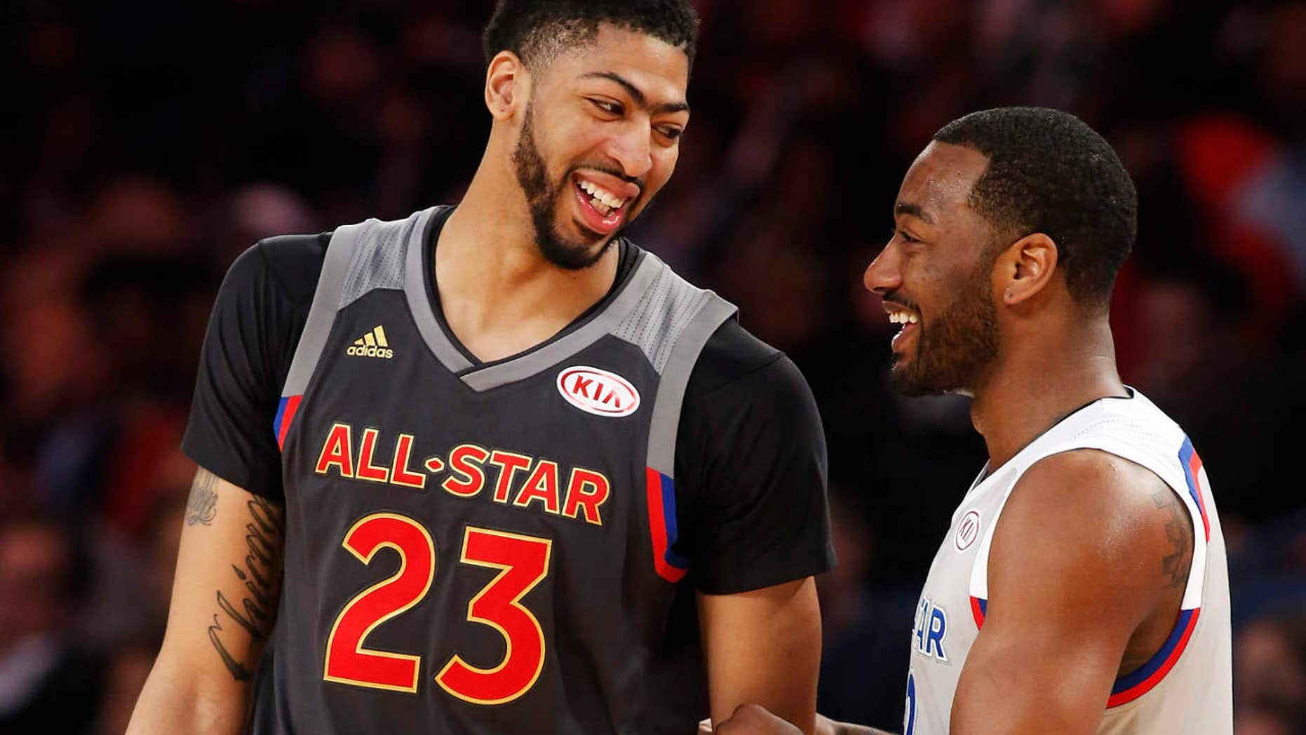 Western Conference forward Anthony Davis of the New Orleans Pelicans (23) laughs with Eastern Conference guard John Wall of the Washington Wizards (2) in the second half of the NBA All-Star basketball game in New Orleans, Sunday, Feb. 19, 2017.
