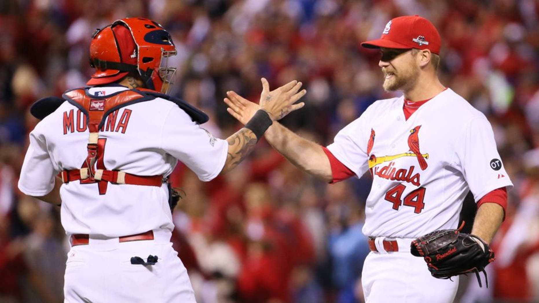 St. Louis Cardinals closer Trevor Rosenthal, right, celebrates with catcher Yadier Molina after preserving the shutout victory in the ninth inning against the Chicago Cubs in Game 1 of the NLDS on Friday, Oct. 9, 2015, at Busch Stadium in St. Louis. The Cards won, 4-0. (Chris Lee/St. Louis Post-Dispatch/TNS via Getty Images)