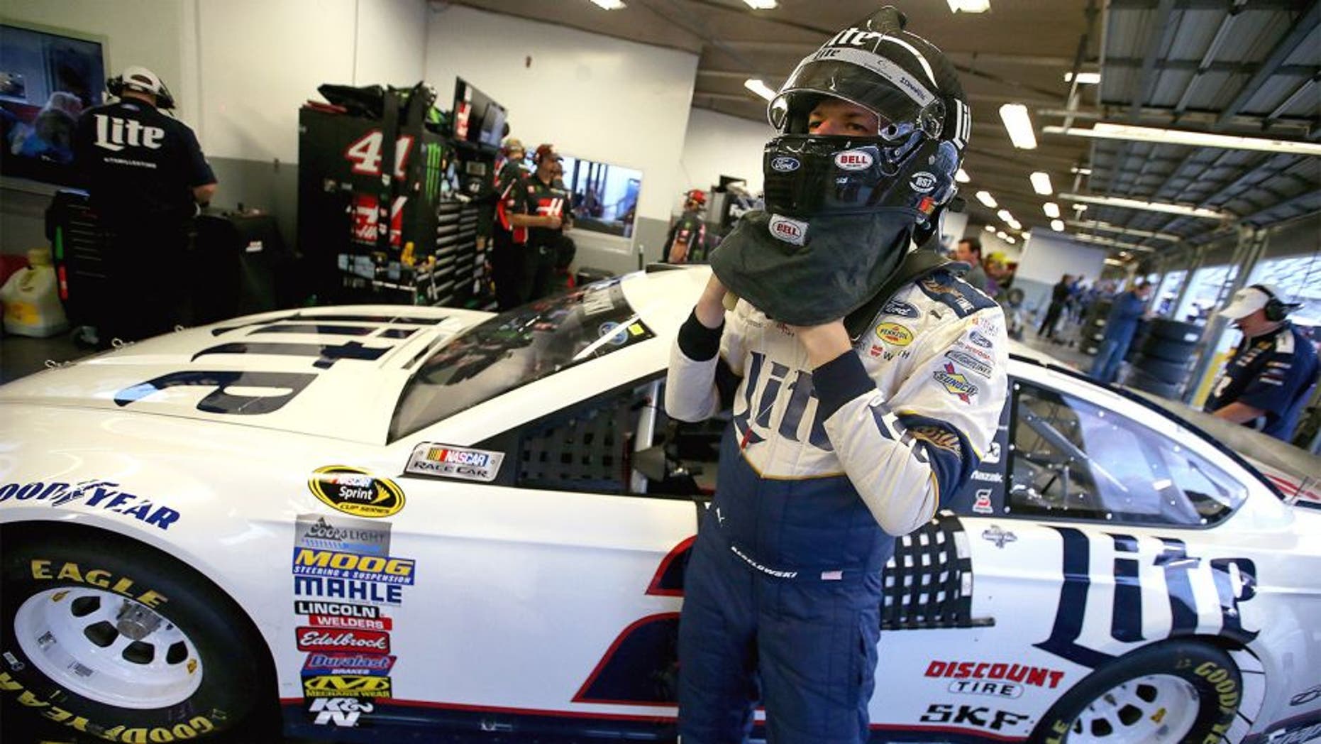 DAYTONA BEACH, FL - FEBRUARY 17: Brad Keselowski, driver of the #2 Miller Lite Ford, stands in the garage area during practice for the Daytona 500 at Daytona International Speedway on February 17, 2016 in Daytona Beach, Florida. (Photo by Sean Gardner/Getty Images)