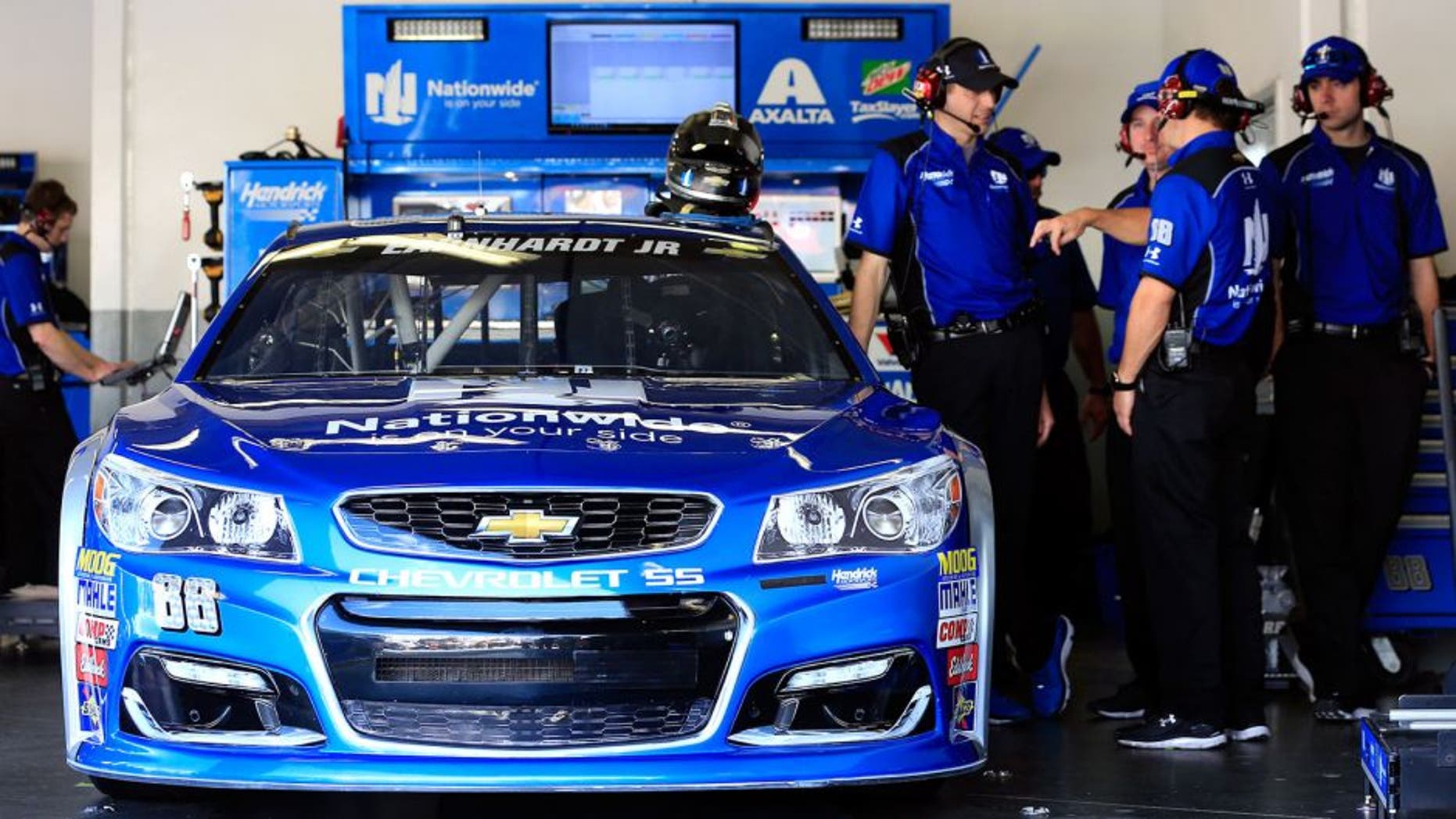 DAYTONA BEACH, FL - FEBRUARY 20: Crew members work on the #88 Nationwide Chevrolet during practice for the NASCAR Sprint Cup Series Daytona 500 at Daytona International Speedway on February 20, 2016 in Daytona Beach, Florida. (Photo by Chris Trotman/NASCAR via Getty Images)