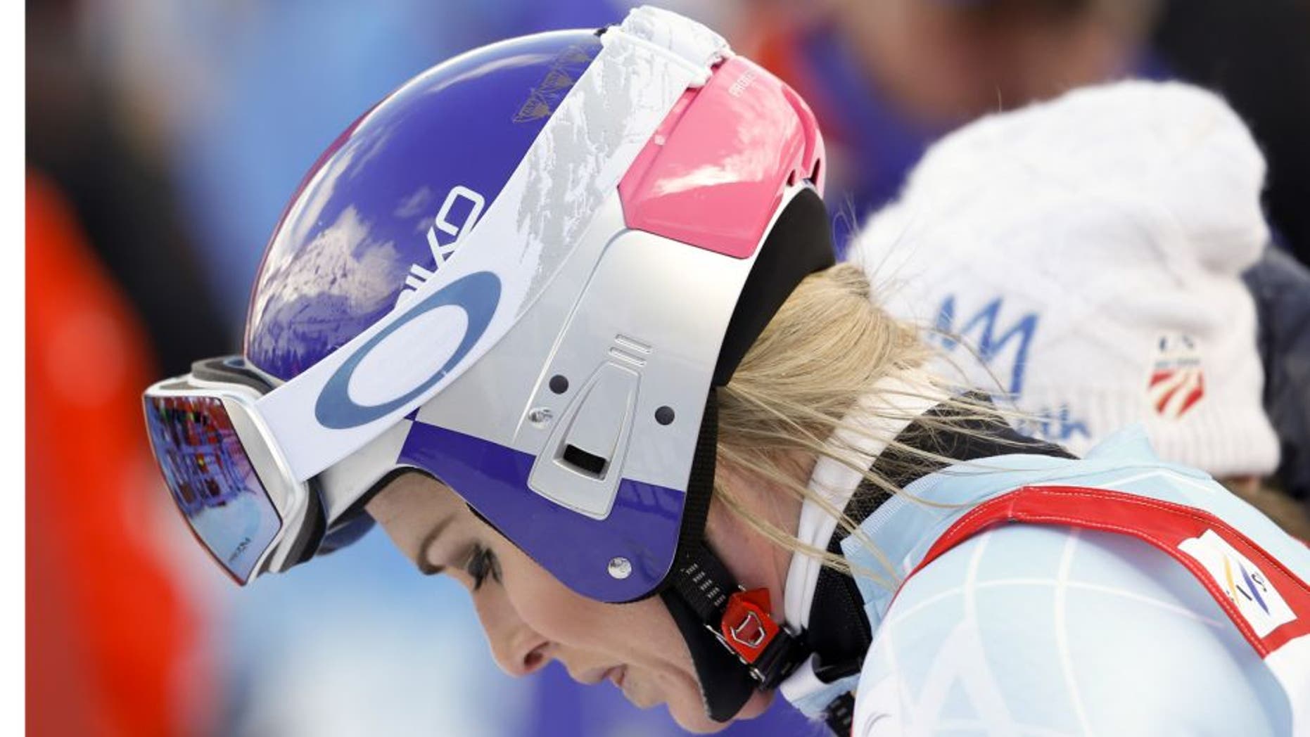 United States' Lindsey Vonn reacts after crashing during a women's Alpine ski downhill race, in La Thuile, Italy, Friday, Feb. 19, 2016. (AP Photo/Alessandro Trovati)