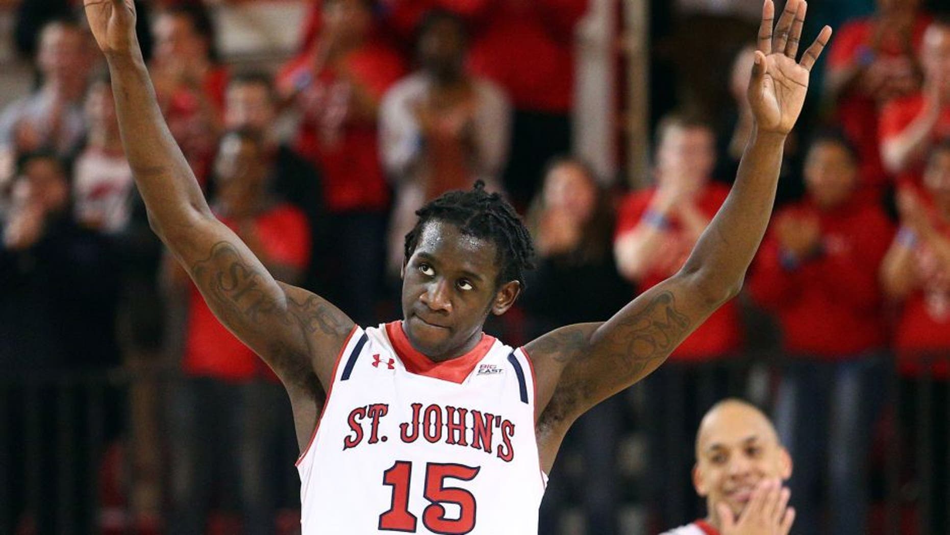 Feb 21, 2015; Jamaica, NY, USA; St. John's Red Storm guard Sir'Dominic Pointer (15) and guard D'Angelo Harrison (11) react during the second half against the Seton Hall Pirates at Carnesecca Arena. Mandatory Credit: Brad Penner-USA TODAY Sports