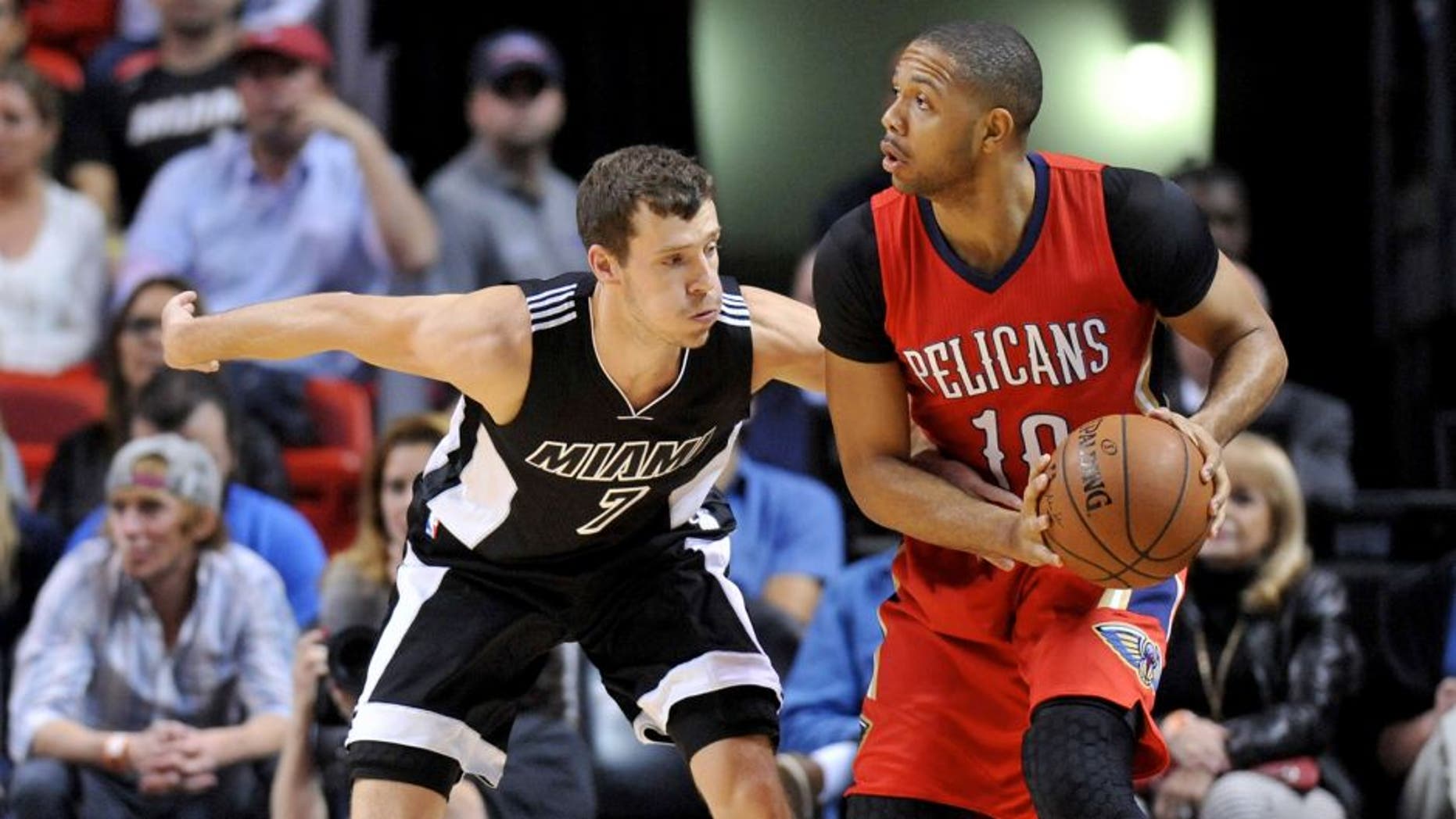 Feb 21, 2015; Miami, FL, USA; Miami Heat guard Goran Dragic (7) pressures New Orleans Pelicans guard Eric Gordon (10) during the first half at American Airlines Arena. Mandatory Credit: Steve Mitchell-USA TODAY Sports