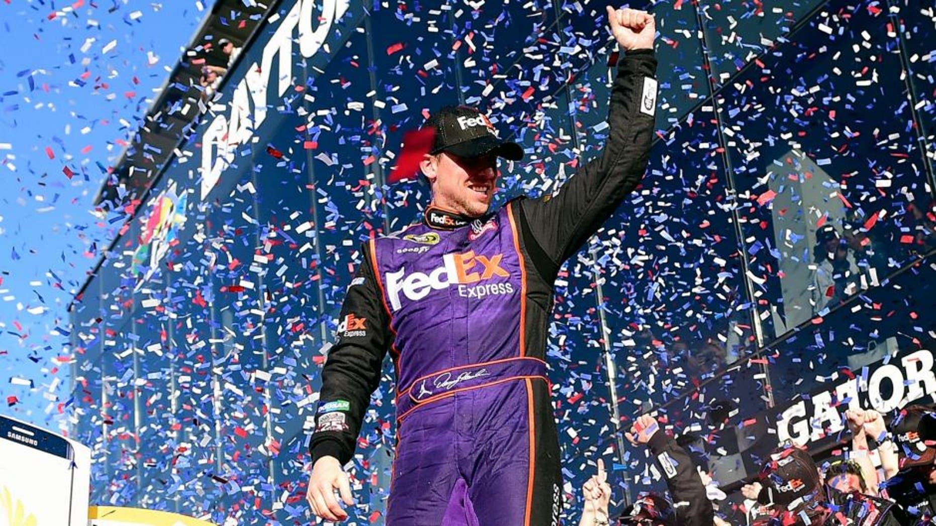 DAYTONA BEACH, FL - FEBRUARY 21: Denny Hamlin, driver of the #11 FedEx Express Toyota, celebrates in Victory Lane after winning the NASCAR Sprint Cup Series DAYTONA 500 at Daytona International Speedway on February 21, 2016 in Daytona Beach, Florida. (Photo by Jared C. Tilton/Getty Images)