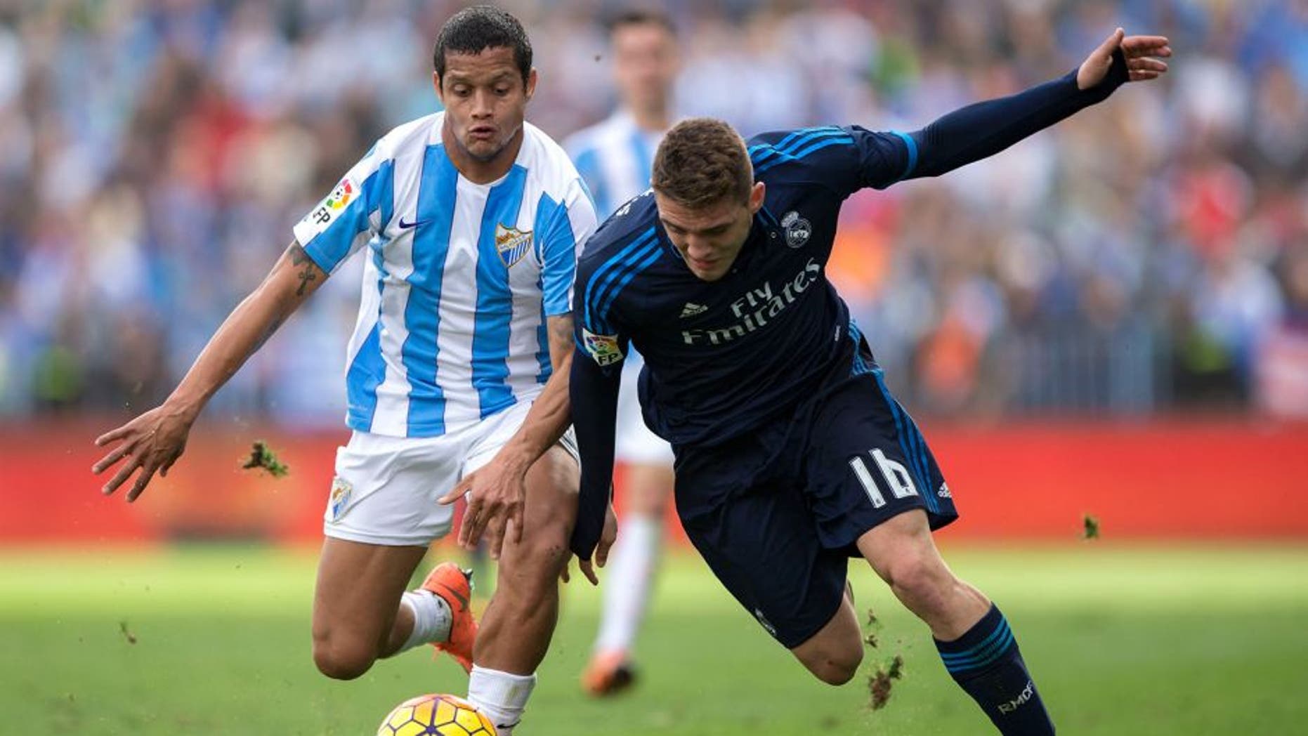 MALAGA, SPAIN - FEBRUARY 21: Mateo Kovacic (R) of Real Madrid CF competes for the ball with Roberto Rosales (L) of Malaga CF during the La Liga match between Malaga CF and Real Madrid CF at La Rosaleda Stadium on February 21, 2016 in Malaga, Spain. (Photo by Gonzalo Arroyo Moreno/Getty Images)