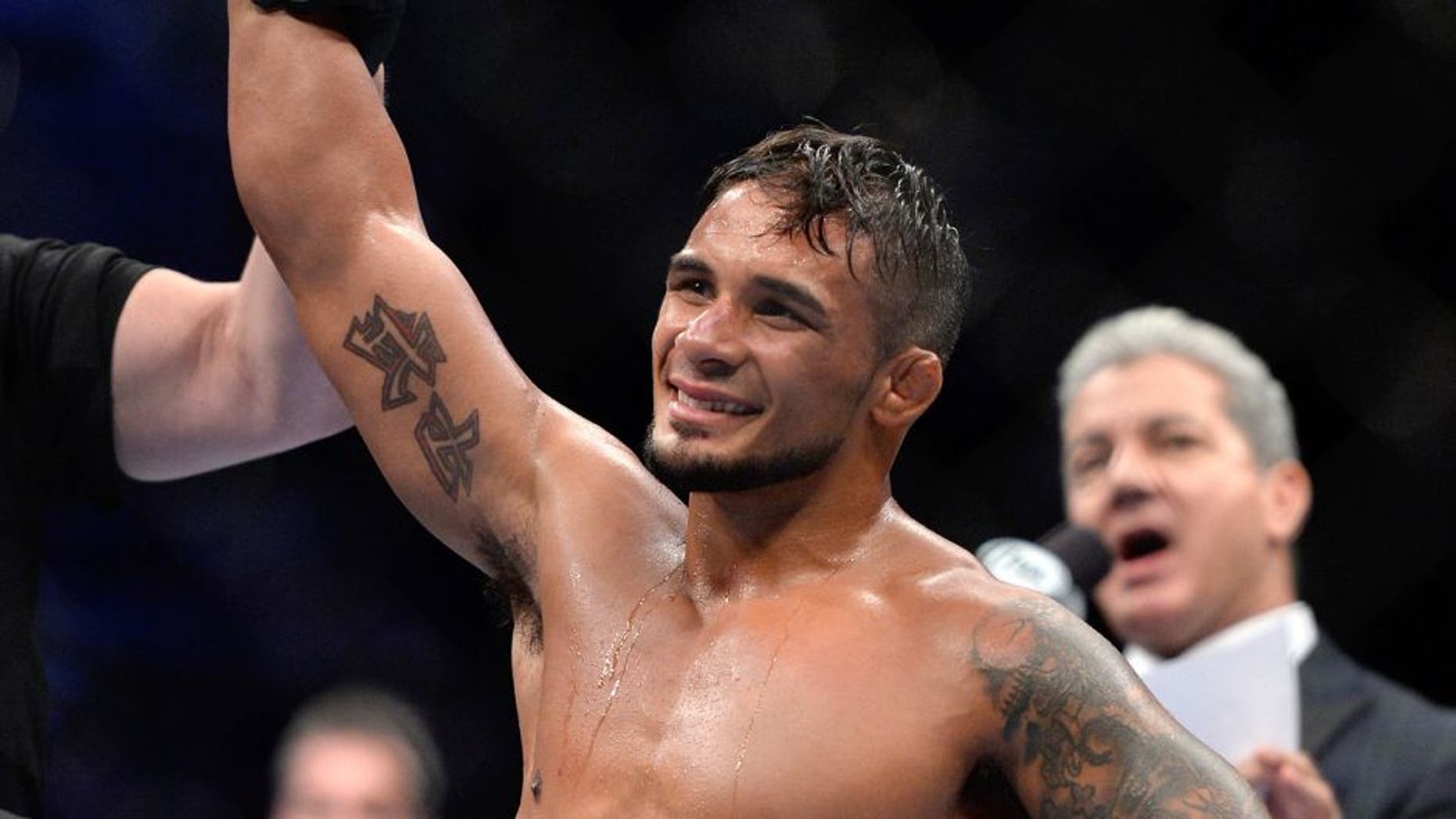 SAN JOSE, CA - JULY 26: Dennis Bermudez celebrates after submitting Clay Guida in their featherweight bout during the UFC Fight Night event at the SAP Center on July 26, 2014 in San Jose, California. (Photo by Jeff Bottari/Zuffa LLC/Zuffa LLC via Getty Images)