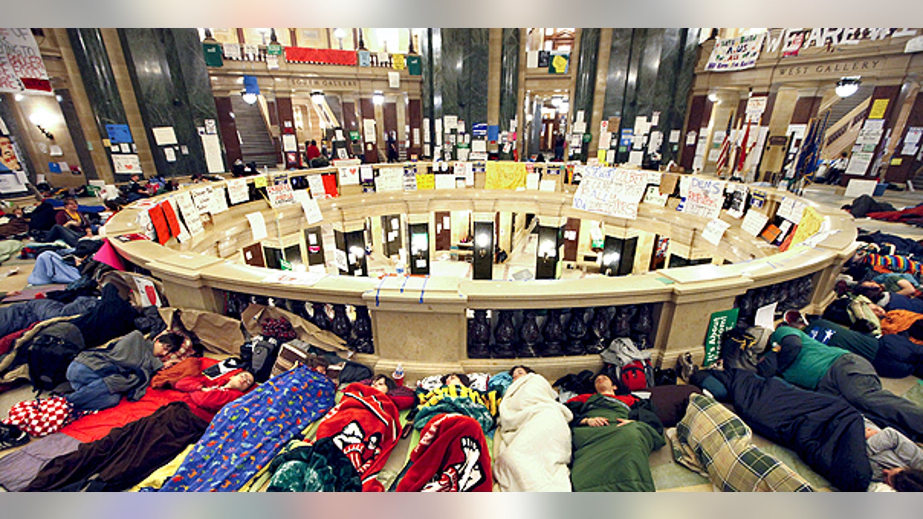 Feb. 22: Opponents of Wisconsin Governor Scott Walker's budget bill sleep in the rotunda of the Wisconsin State Capitol.