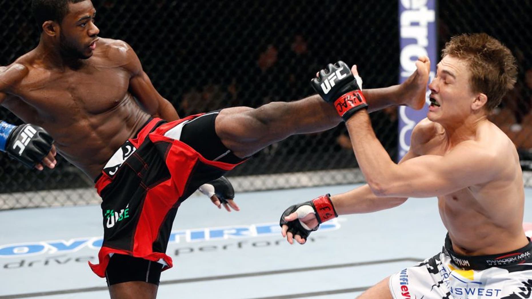 LAS VEGAS, NV - FEBRUARY 22: (L-R) Aljamain Sterling kicks Cody Gibson in their bantamweight bout during UFC 170 inside the Mandalay Bay Events Center on February 22, 2014 in Las Vegas, Nevada. (Photo by Josh Hedges/Zuffa LLC/Zuffa LLC via Getty Images)