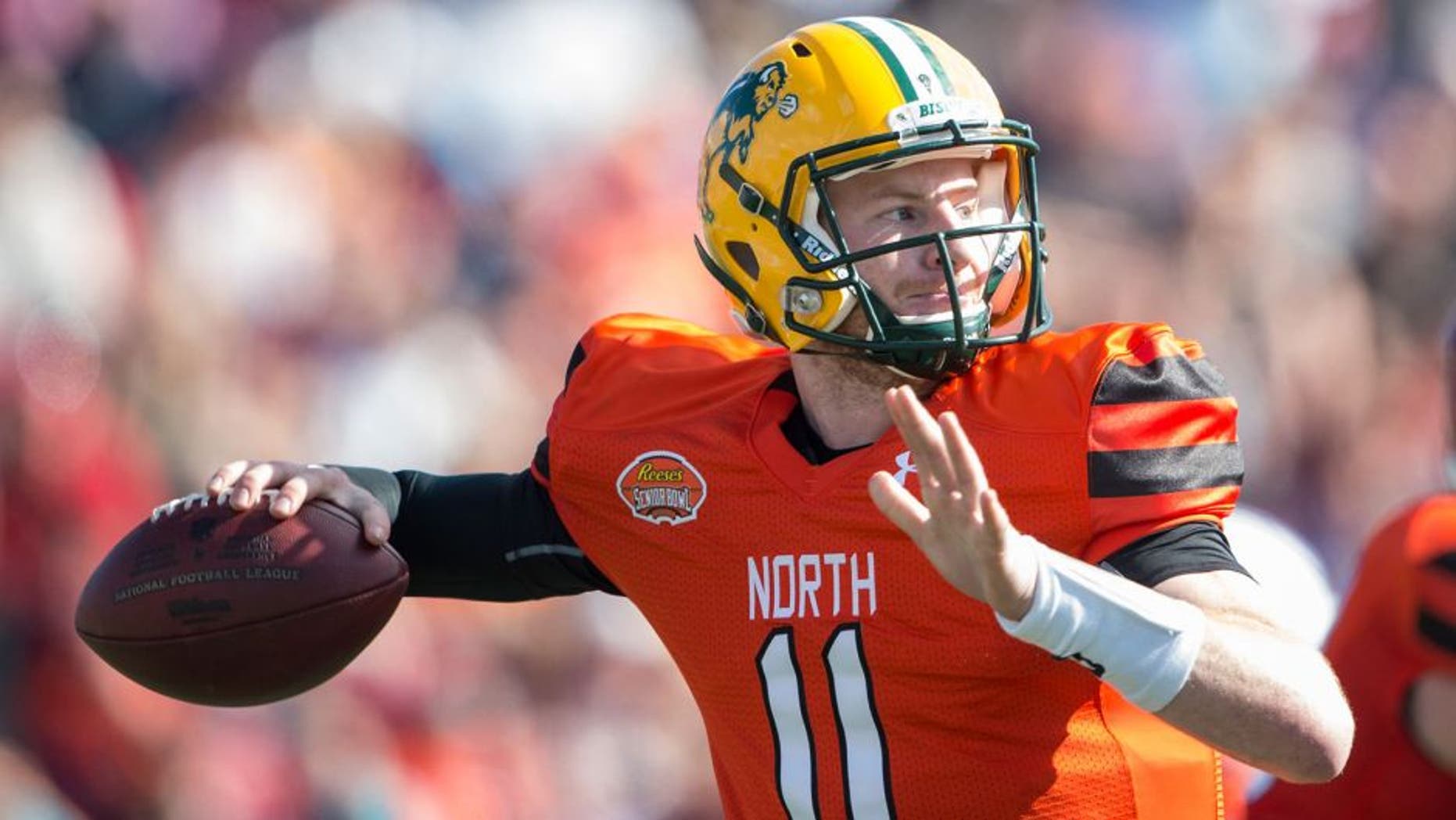 MOBILE, AL - JANUARY 30: North team's quarterback Carson Wentz #11 with North Dakota State looks to throw a pass during their game against the South Team on January 30, 2016 at Ladd-Peebles Stadium in Mobile, Alabama. (Photo by Michael Chang/Getty Images)