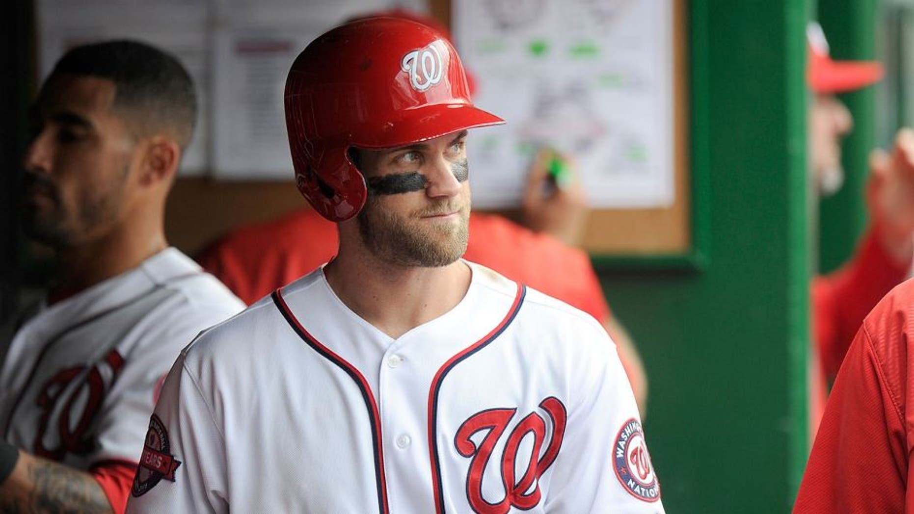 WASHINGTON, DC - SEPTEMBER 27: Bryce Harper #34 of the Washington Nationals watches the game against the Philadelphia Phillies at Nationals Park on September 27, 2015 in Washington, DC. (Photo by G Fiume/Getty Images)