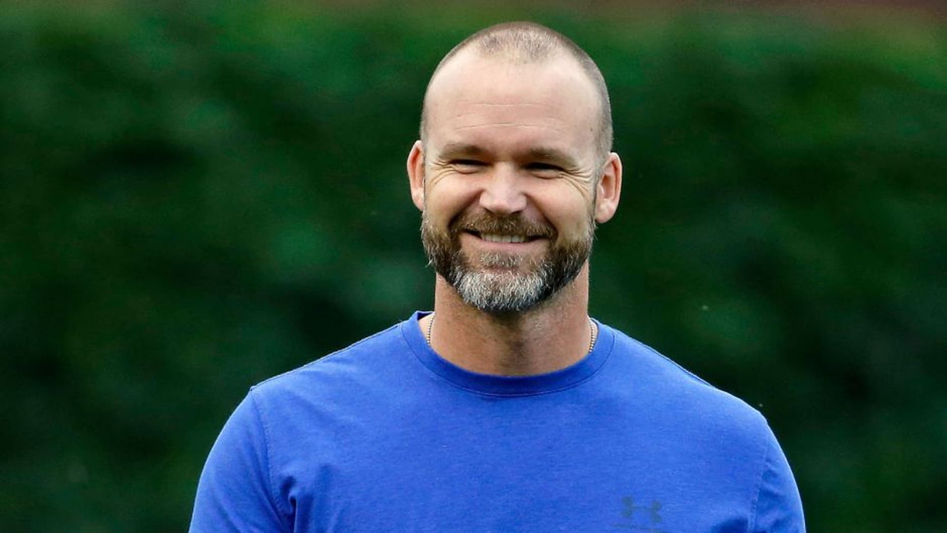 CHICAGO, IL - JUNE 11: David Ross #3 of the Chicago Cubs smiles during batting practice before the game against the Cincinnati Reds at Wrigley Field on June 11, 2015 in Chicago, Illinois. (Photo by Jon Durr/Getty Images)