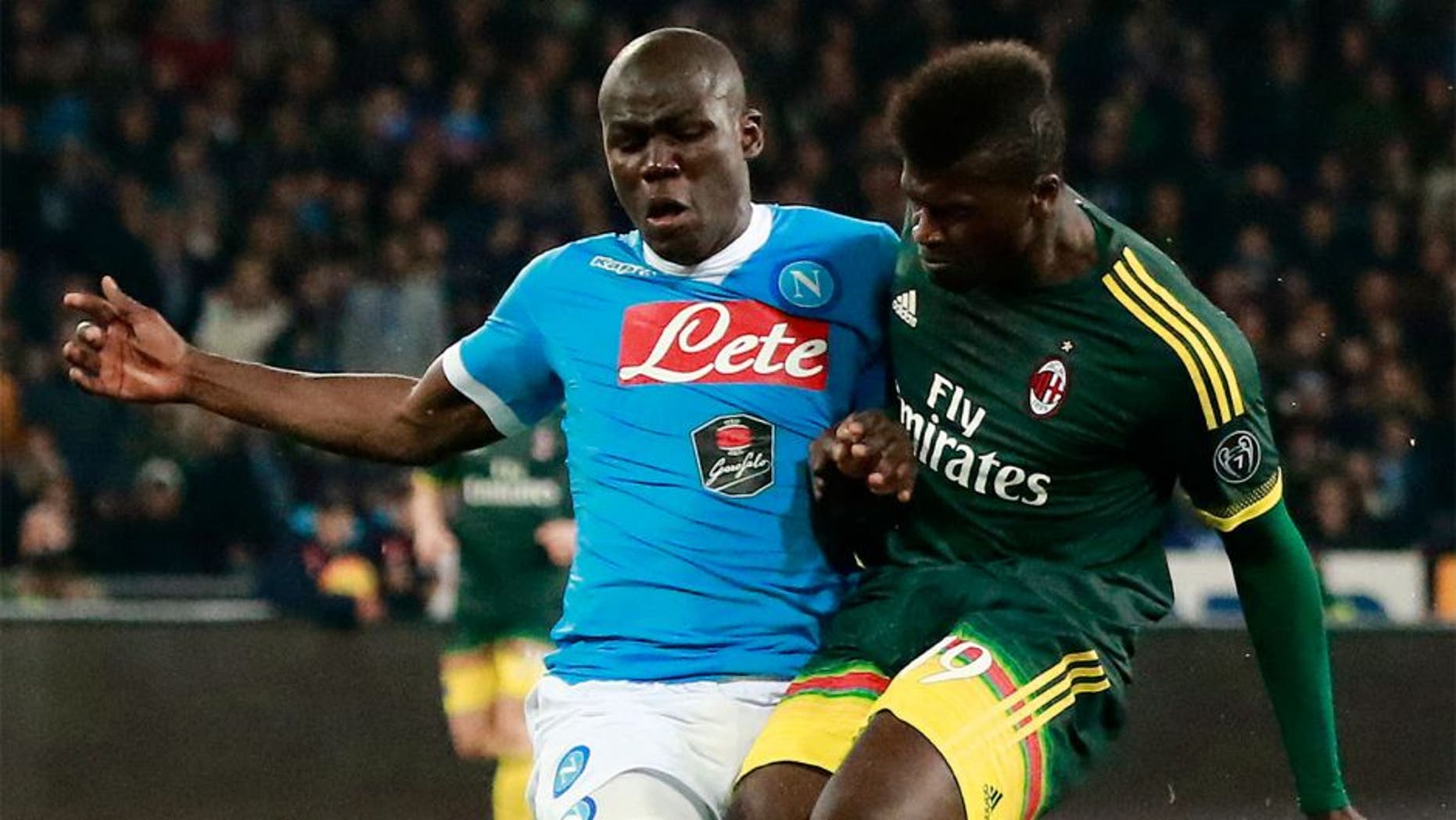 AC Milan's French forward M'Baye Niang (R) fights for the ball with Napoli's French defender Kalidou Koulibaly during the Italian Serie A football match SSC Napoli vs AC Milan on February 22, 2016 at the San Paolo stadium in Naples. / AFP / CARLO HERMANN (Photo credit should read CARLO HERMANN/AFP/Getty Images)