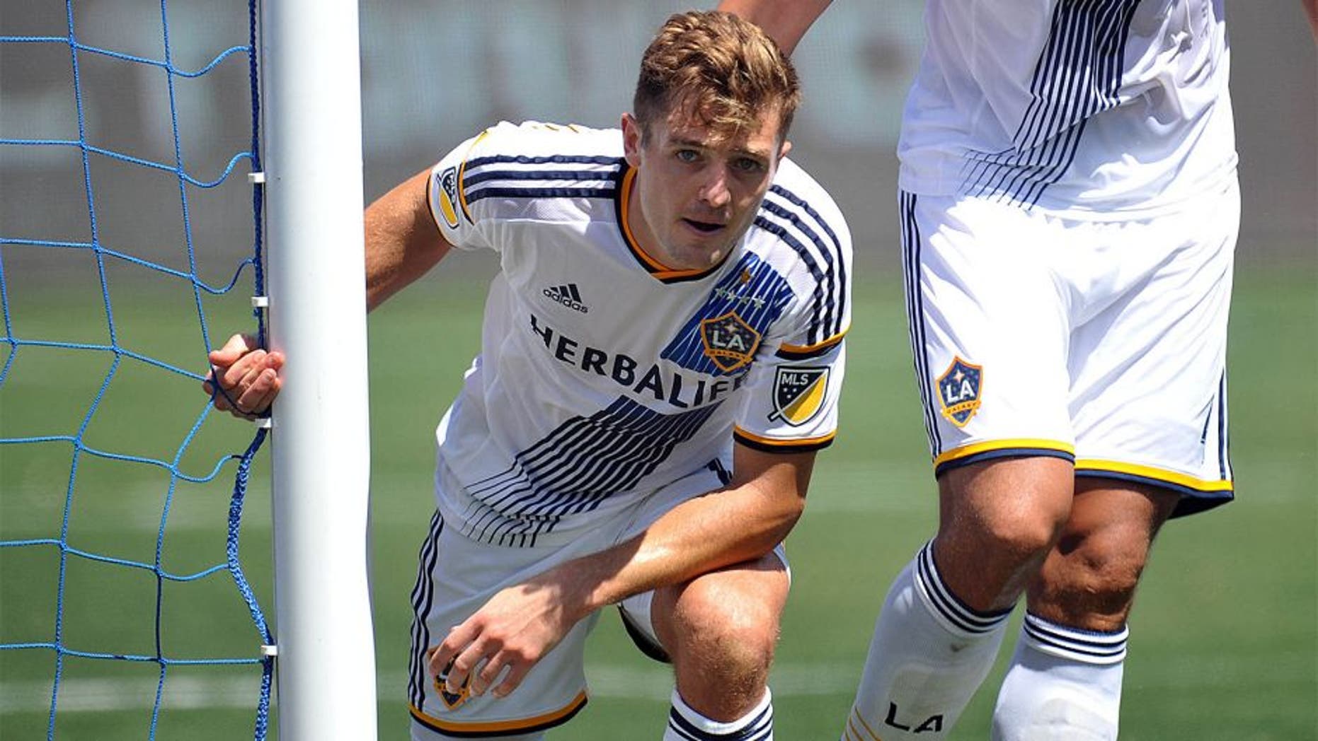 August 9, 2015; Carson, CA, USA; Los Angeles Galaxy midfielder Robbie Rogers (14) reacts after making a defensive play against Seattle Sounders during the second half at StubHub Center. Mandatory Credit: Gary A. Vasquez-USA TODAY Sports