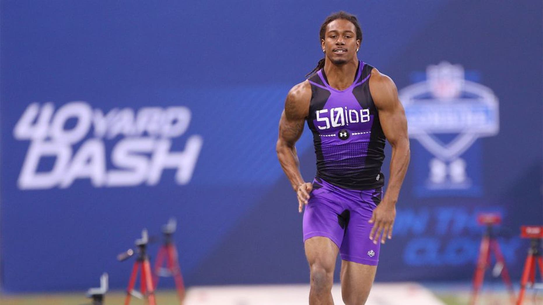 Feb 23, 2015; Indianapolis, IN, USA; Michigan State Spartans defensive back Trae Waynes runs the 40 yard dash and crosses the finish line with all the stop watch timers during the 2015 NFL Combine at Lucas Oil Stadium. Mandatory Credit: Brian Spurlock-USA TODAY Sports