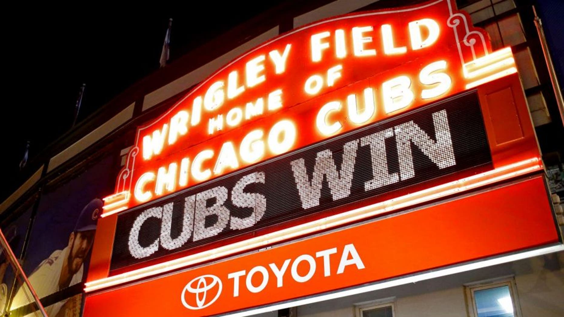 CHICAGO, IL - OCTOBER 13: The Wrigley Field marquee shows "Cubs Win" after the Chicago Cubs beat the St. Louis Cardinals in Game Four to win the National League Divisional Series on October 13, 2015 in Chicago, Illinois. (Photo by Jon Durr/Getty Images)