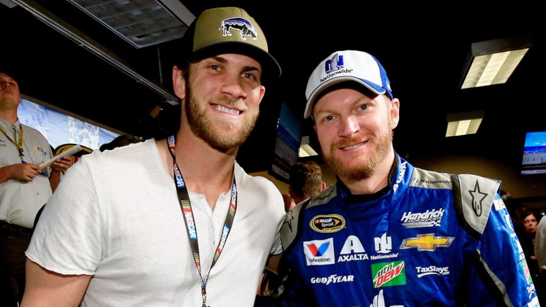DAYTONA BEACH, FL - FEBRUARY 21: Bryce Harper poses with Dale Earnhardt Jr., driver of the #88 Nationwide Chevrolet at the driver's meeting prior to the NASCAR Sprint Cup Series DAYTONA 500 at Daytona International Speedway on February 21, 2016 in Daytona Beach, Florida. (Photo by Chris Trotman/NASCAR via Getty Images)