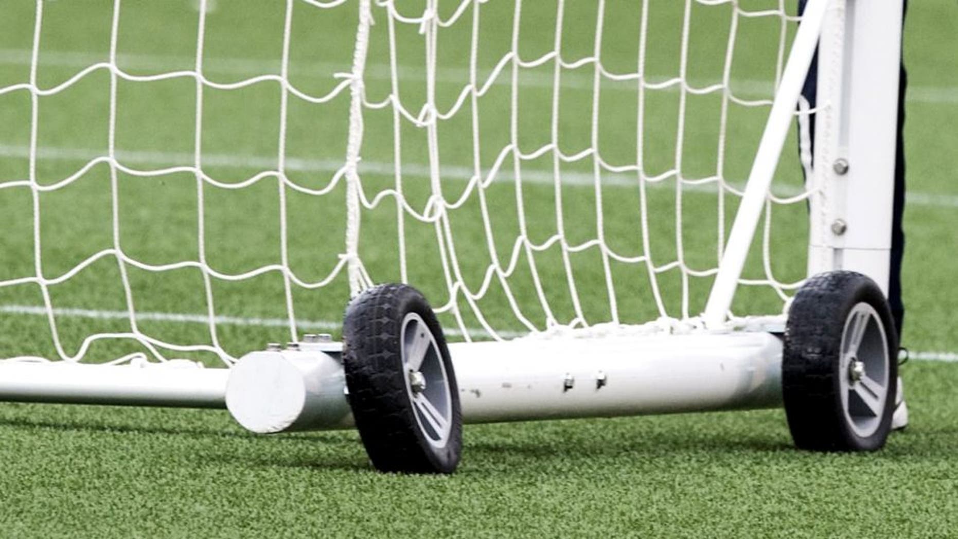 France's coach Philippe Bergeroo pushes a goal cage during a training session at Lansdowne Stadium in Ottawa on June 16, 2015 on the eve of the team's 2015 FIFA Women's World Cup Group F football match against Mexico. AFP PHOTO/NICHOLAS KAMM (Photo credit should read NICHOLAS KAMM/AFP/Getty Images)