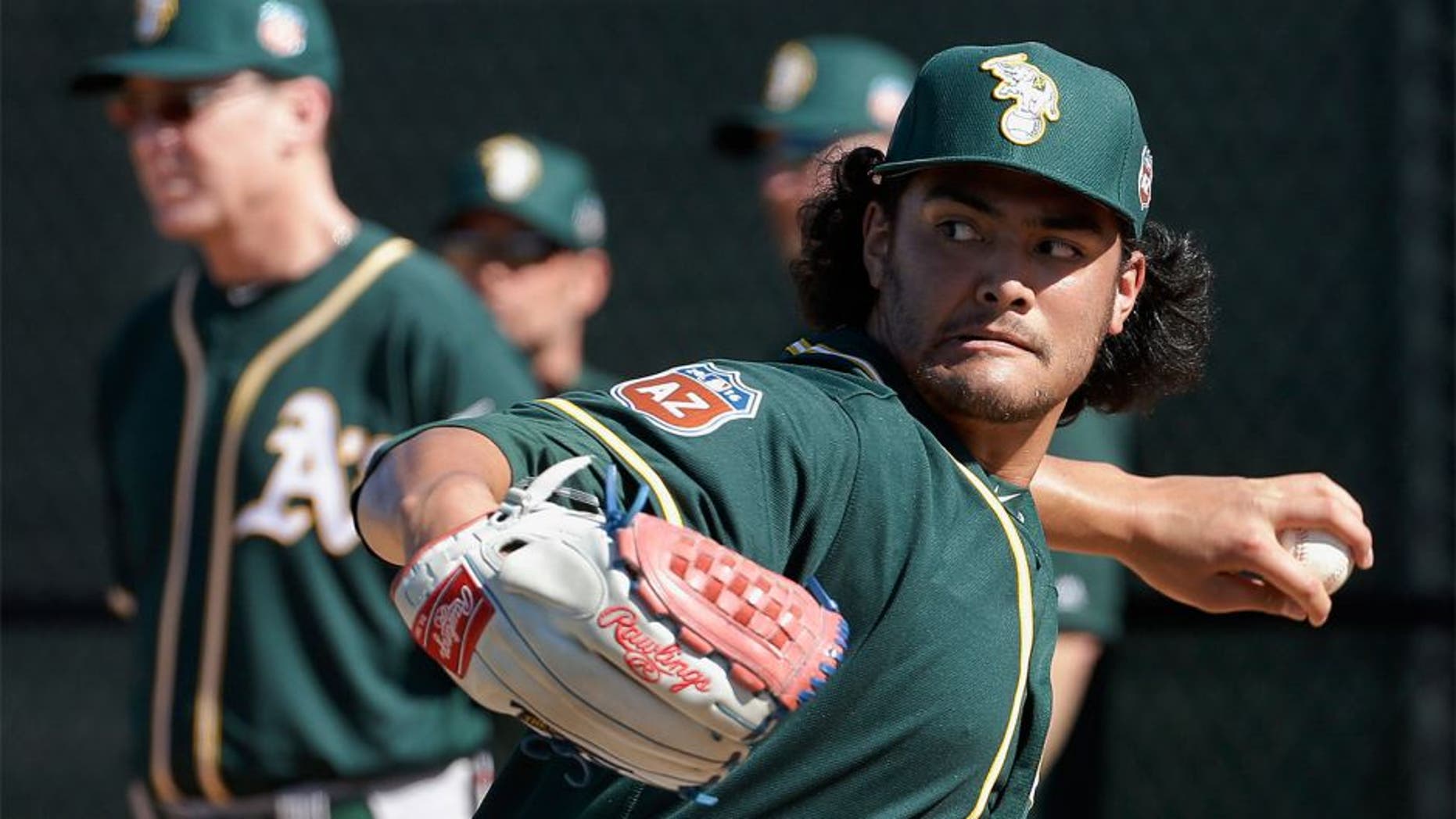 Oakland Athletics pitcher Sean Manaea throws during spring training baseball practice in Mesa, Ariz., Sunday, Feb. 21, 2016. (AP Photo/Chris Carlson)