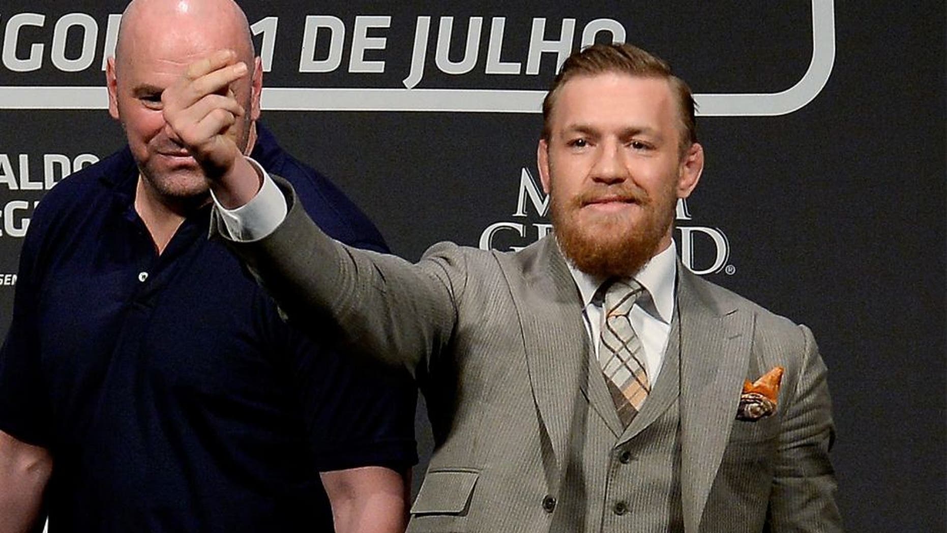 RIO DE JANEIRO, BRAZIL - MARCH 20: UFC featherweight champion Jose Aldo of Brazil (L) and challenger Conor McGregor of Irleland face off as UFC President Dana White (C) stands in during the 189 World Media Tour Launch press conference at Maracanazinho, at Maracanazinho on March 20, 2015 in Rio de Janeiro, Brazil. (Photo by Alexandre Loureiro/Zuffa LLC/Zuffa LLC via Getty Images)