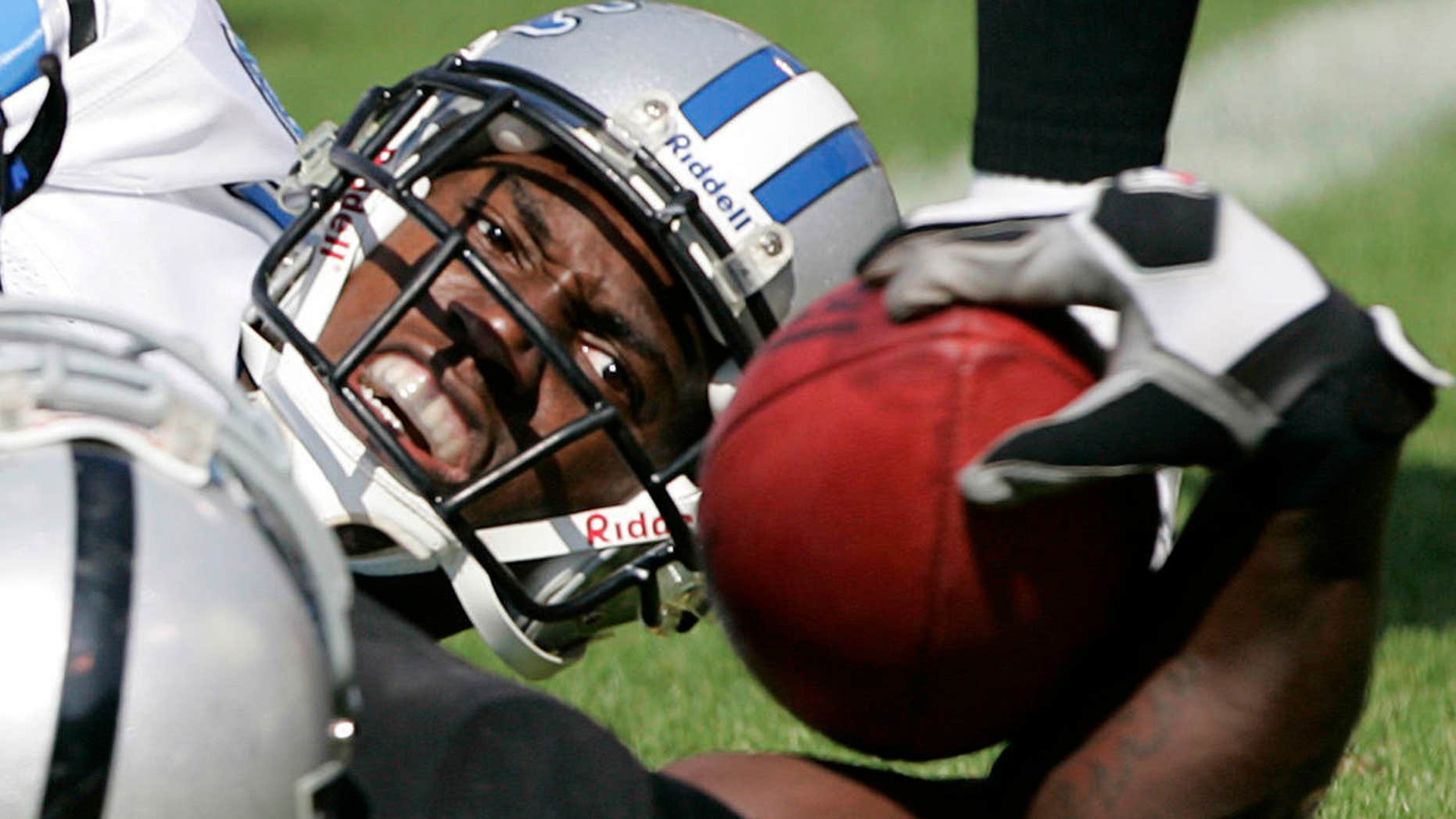 Former Detroit Lions player Fernando Bryant was fired from his job at a Christian prep school over a social media picutre.